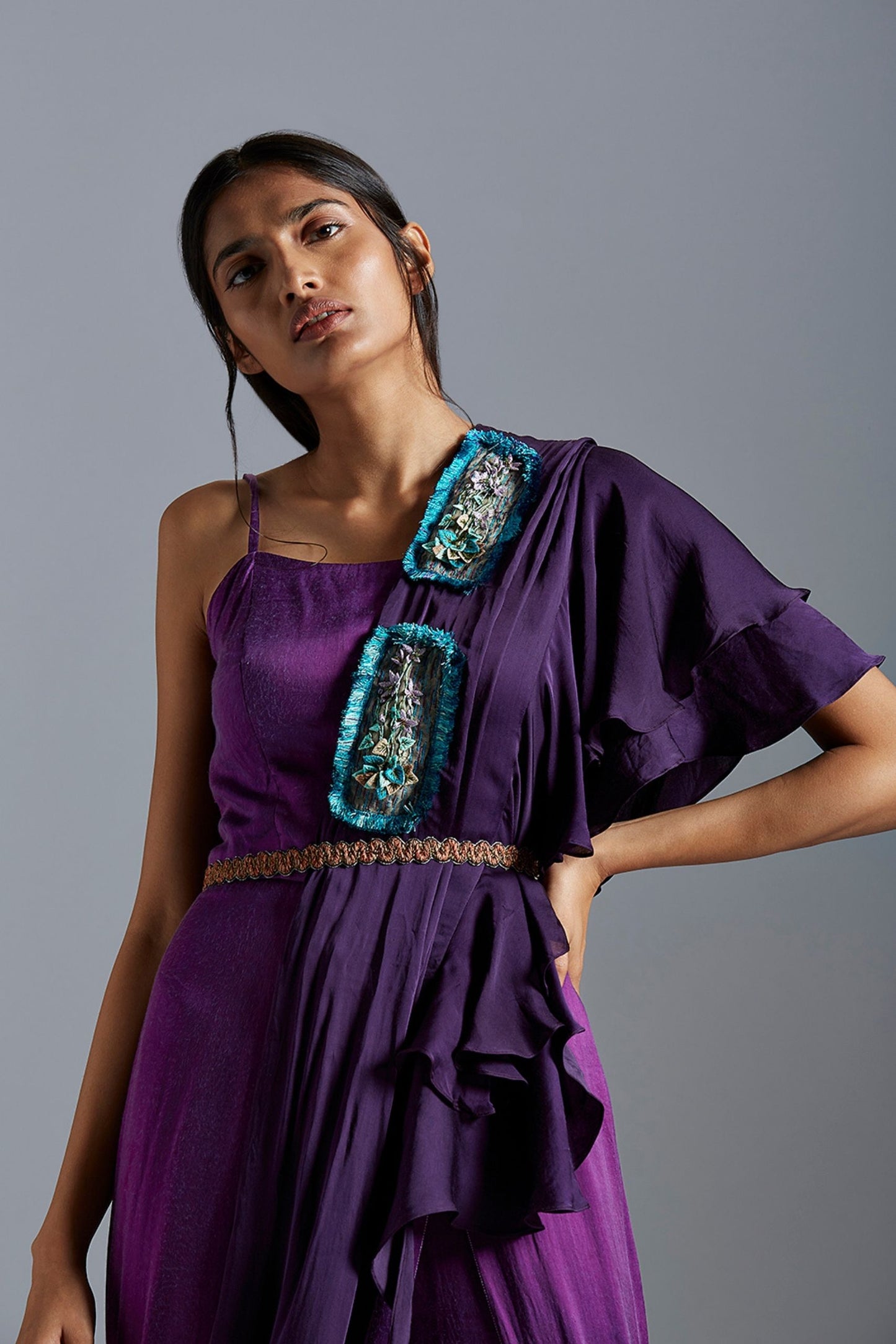 Model wearing the stylish purple ombre jumpsuit with stole and lotus belt, exuding a modern and unique look