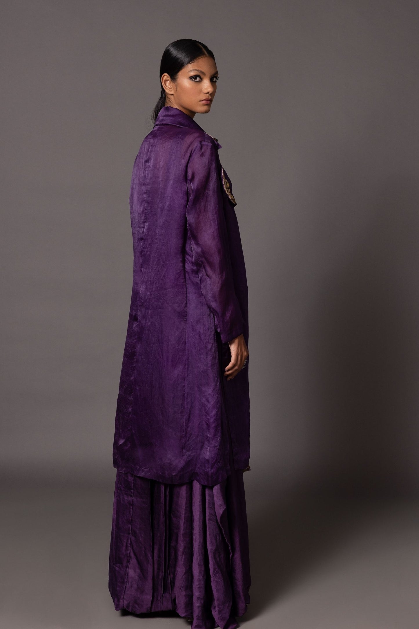 Back view of the Purple Carpet Jacket and Roma purple corset gown, showcasing the detailed metallic embroidery