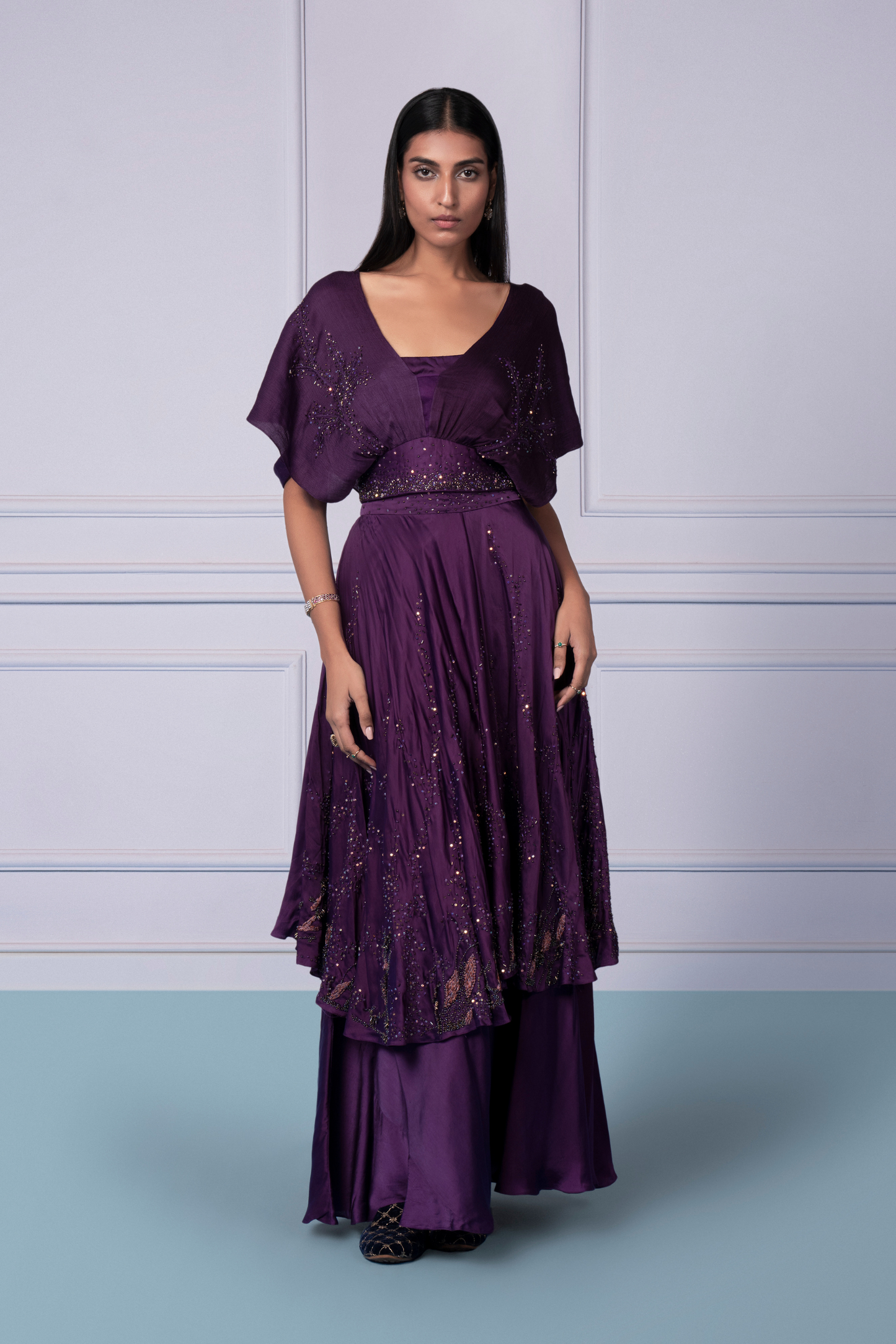 Model wearing the Midnight blouse with beadwork and 2-tier skirt, exuding modern elegance and stylish charm