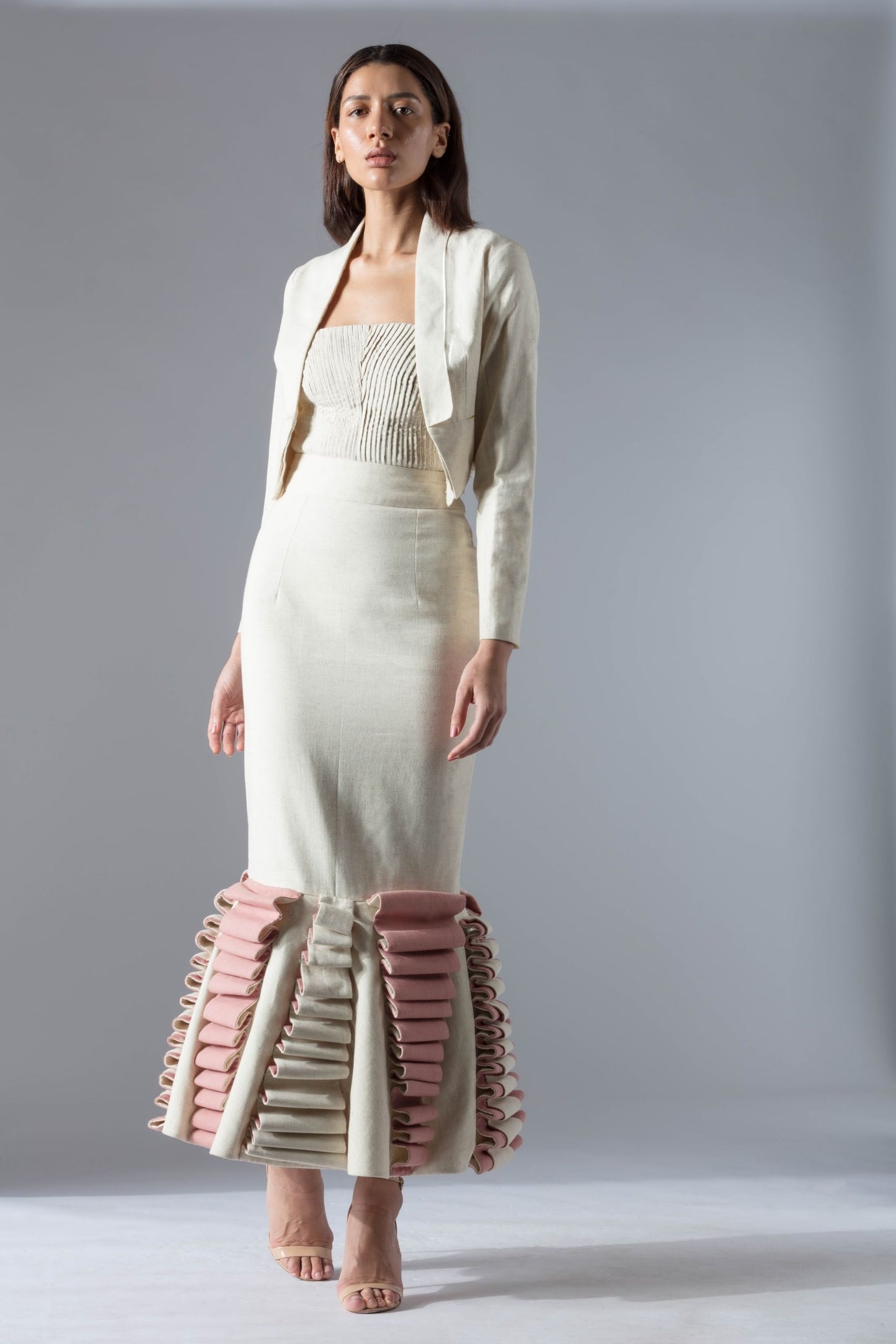 White tuxedo jacket and corset skirt set in organic khadi, showcasing couture elegance