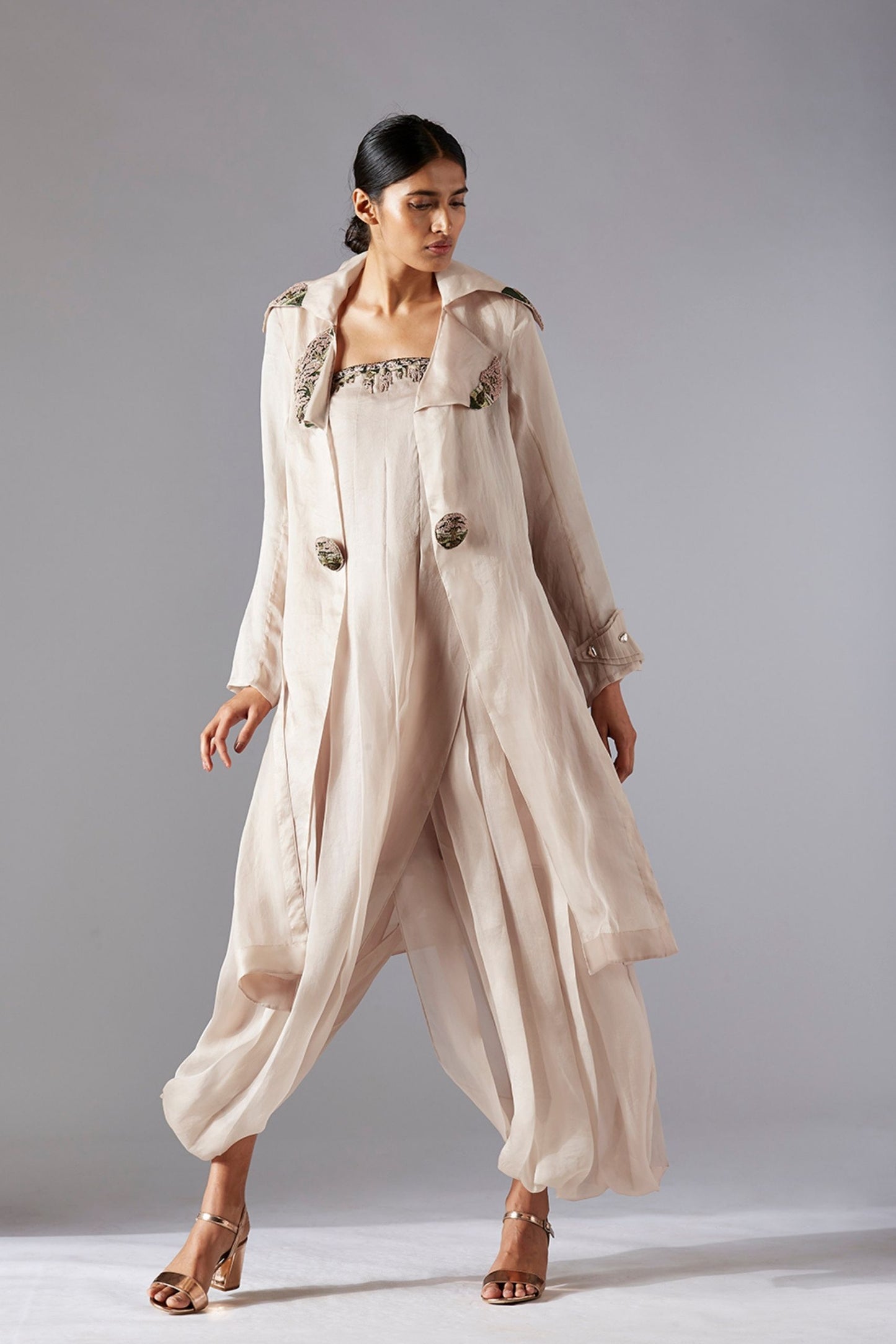 Designer organza jacket with 3D rug-hooking details paired with a pleated tube jumpsuit featuring intricate embroidery, offering a stylish and modern look for women