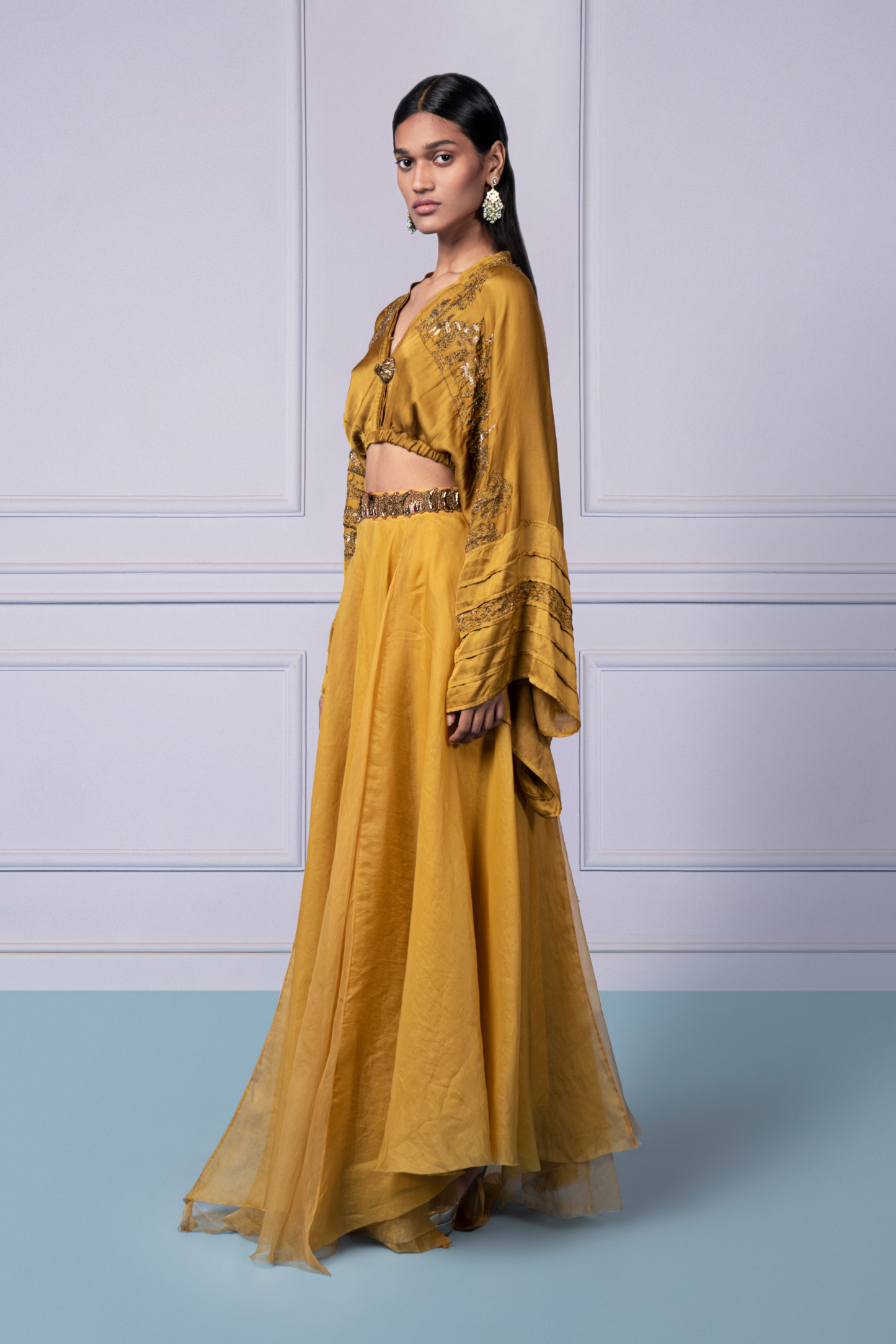 Side view of the yellow kimono top with metallic embroidery and organza lehenga, highlighting the flattering silhouette