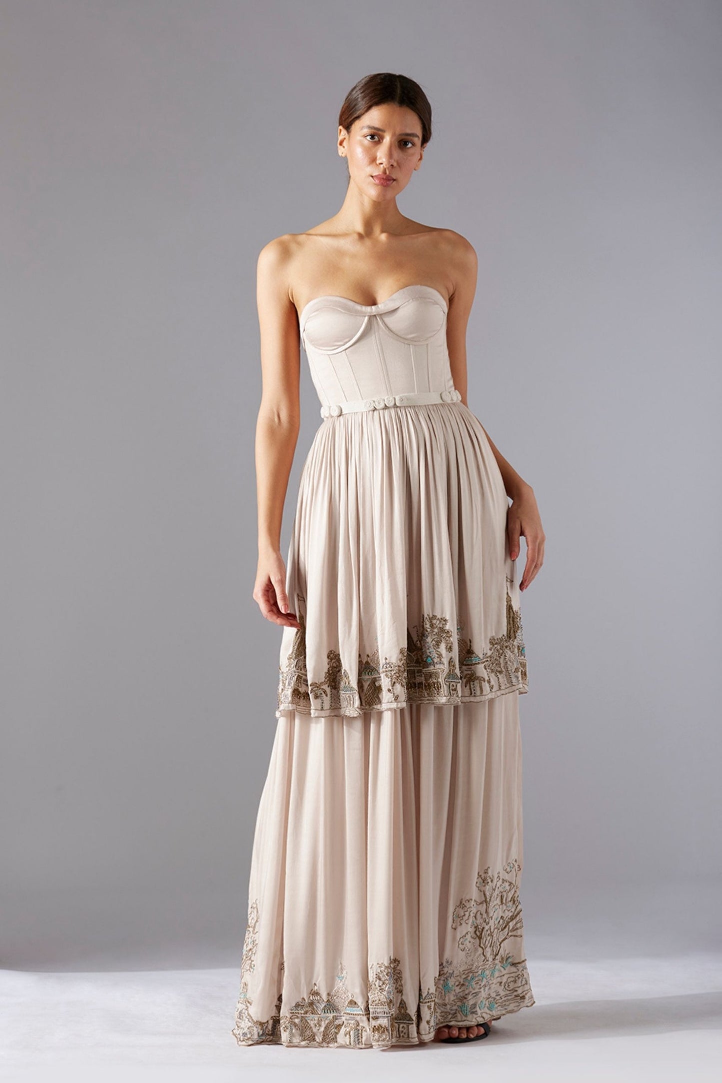 Full view of golden metallic handwork on the Indo Western gown, highlighting the luxurious elements