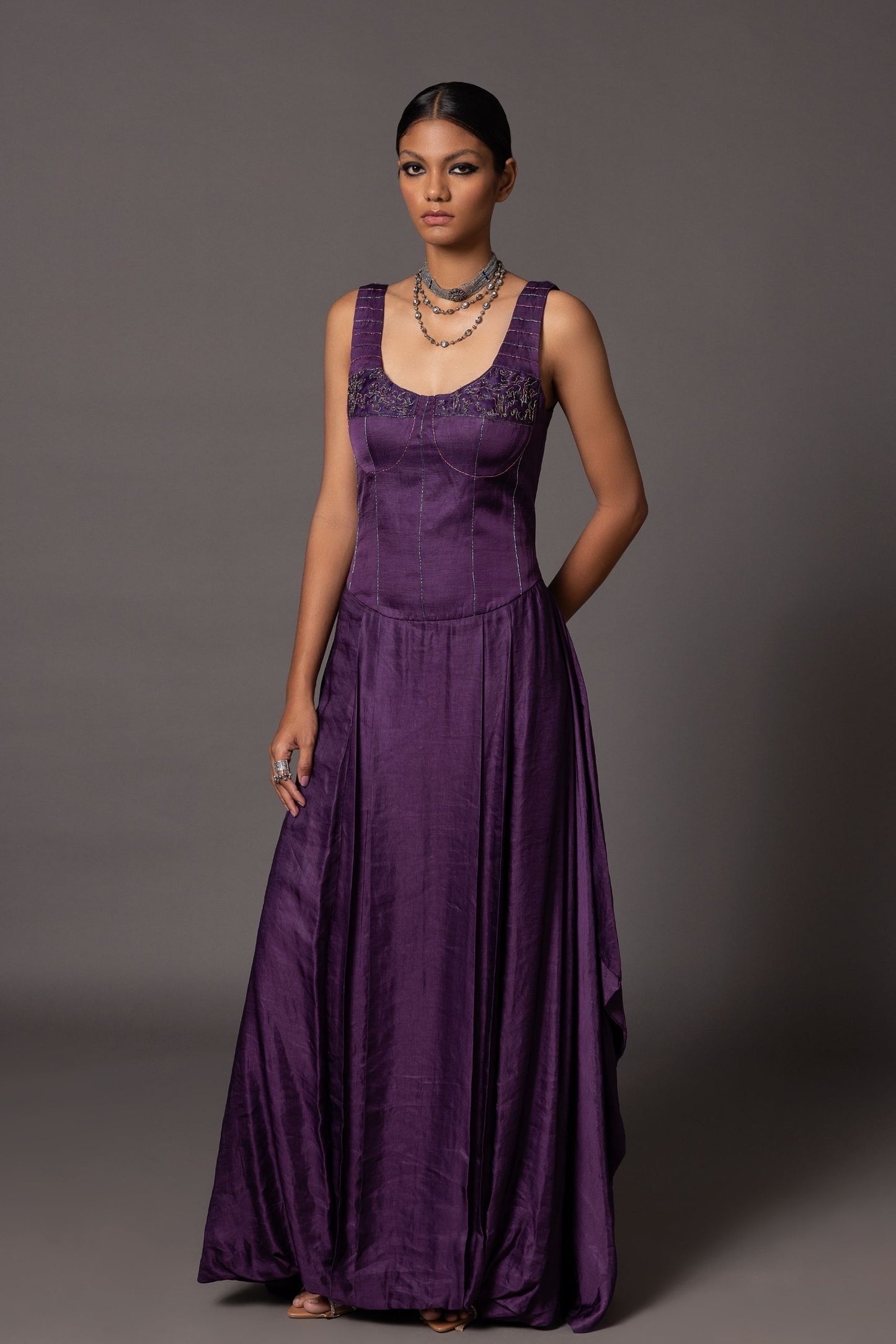 Full view of the metallic embroidery on the Roma purple corset gown, emphasizing the luxury fabric and embroidery details