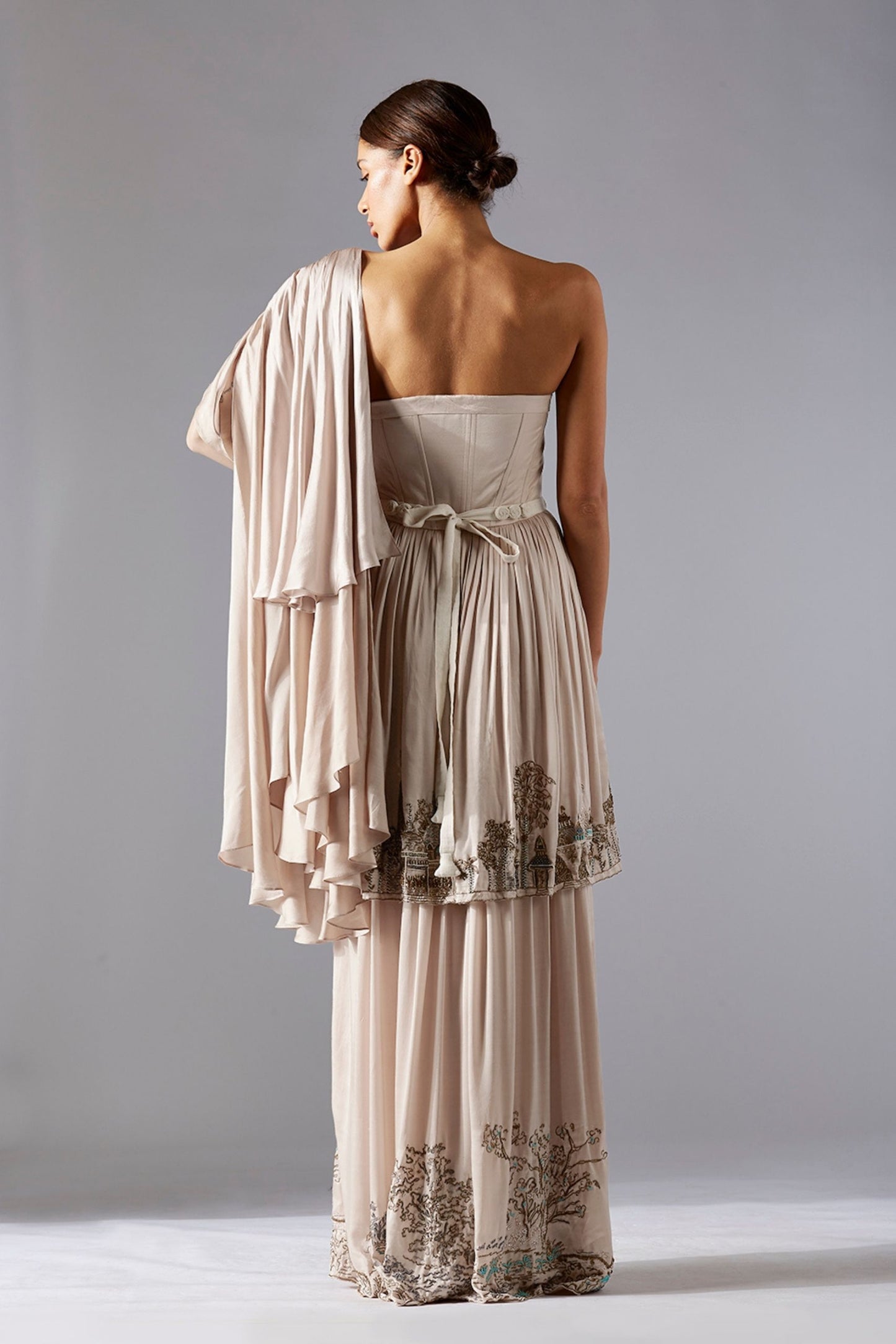 Back view of the Indo Western gown with frill dupatta, emphasizing the graceful drape and stunning details