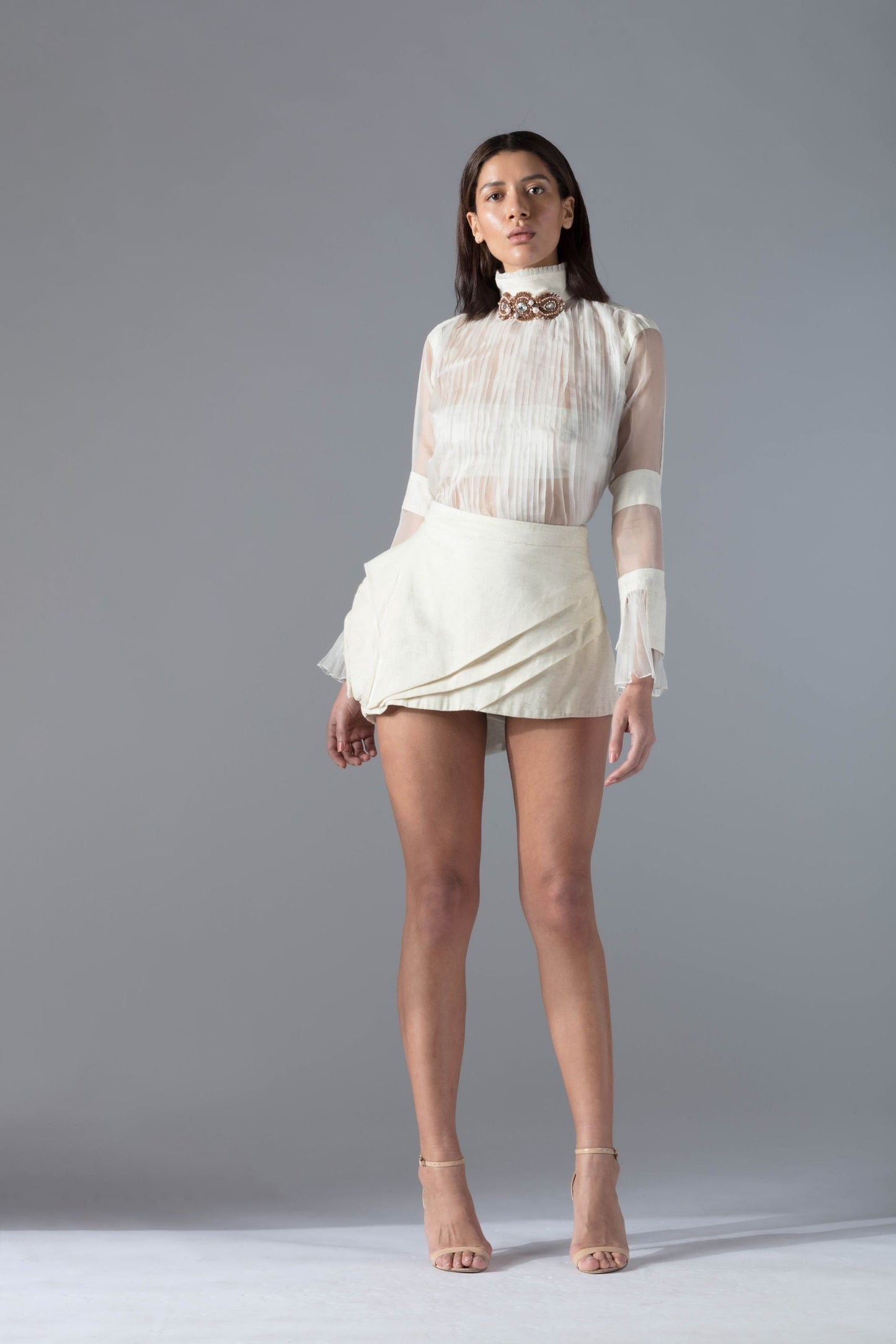Front view of the khadi fabric and hand-molded rose detail on the Rose Leap short skirt