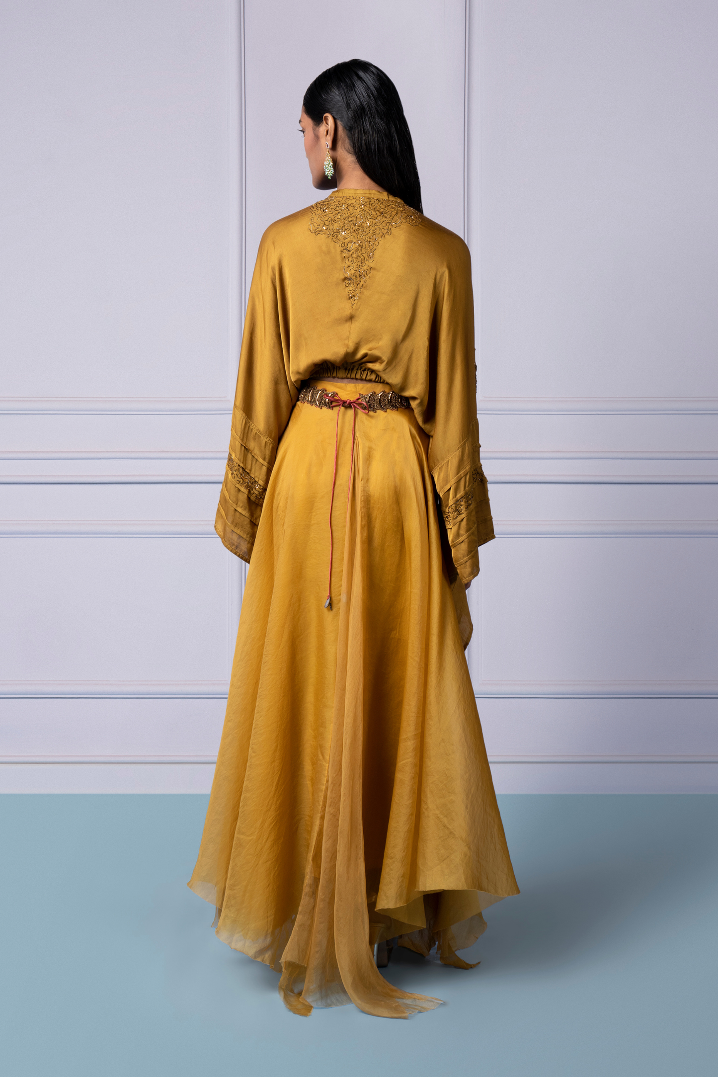 Back view of the yellow kimono top and organza lehenga, showcasing the sleek design and flowy lehenga