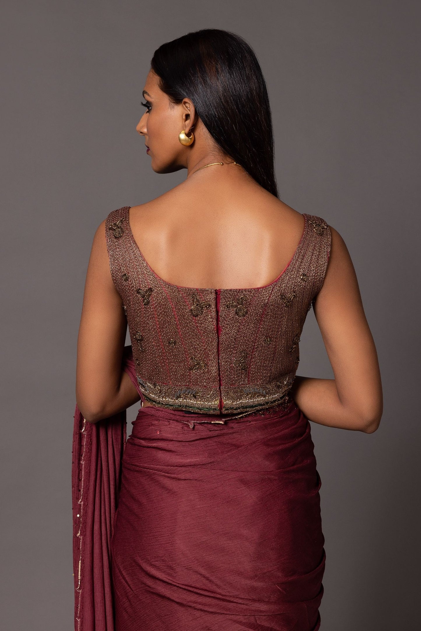 Back view of the Namib metallic blouse showing the smooth design and floral thread work