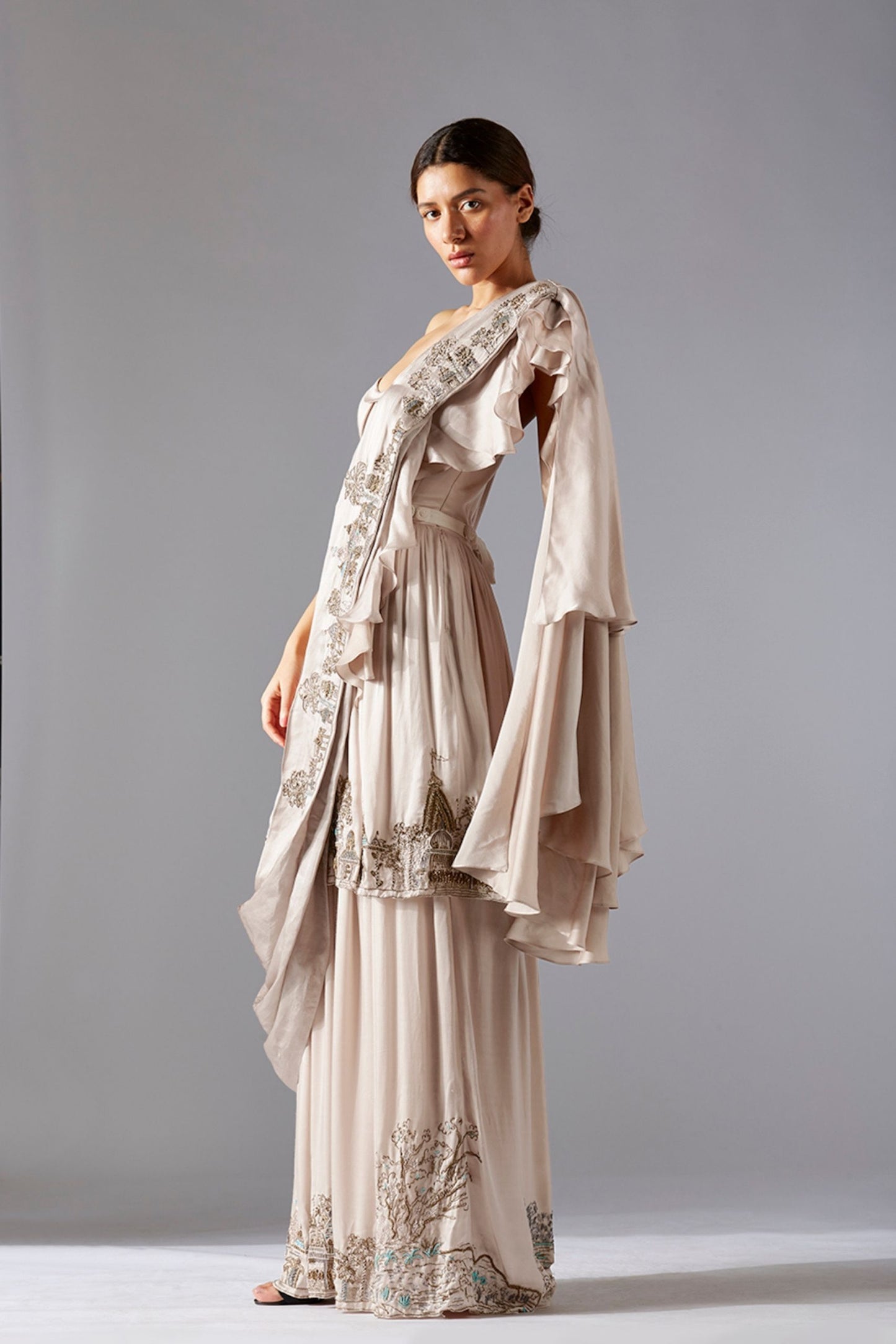 Side profile of the Indo Western gown, showcasing the flow of the gown and the layered frill dupatta