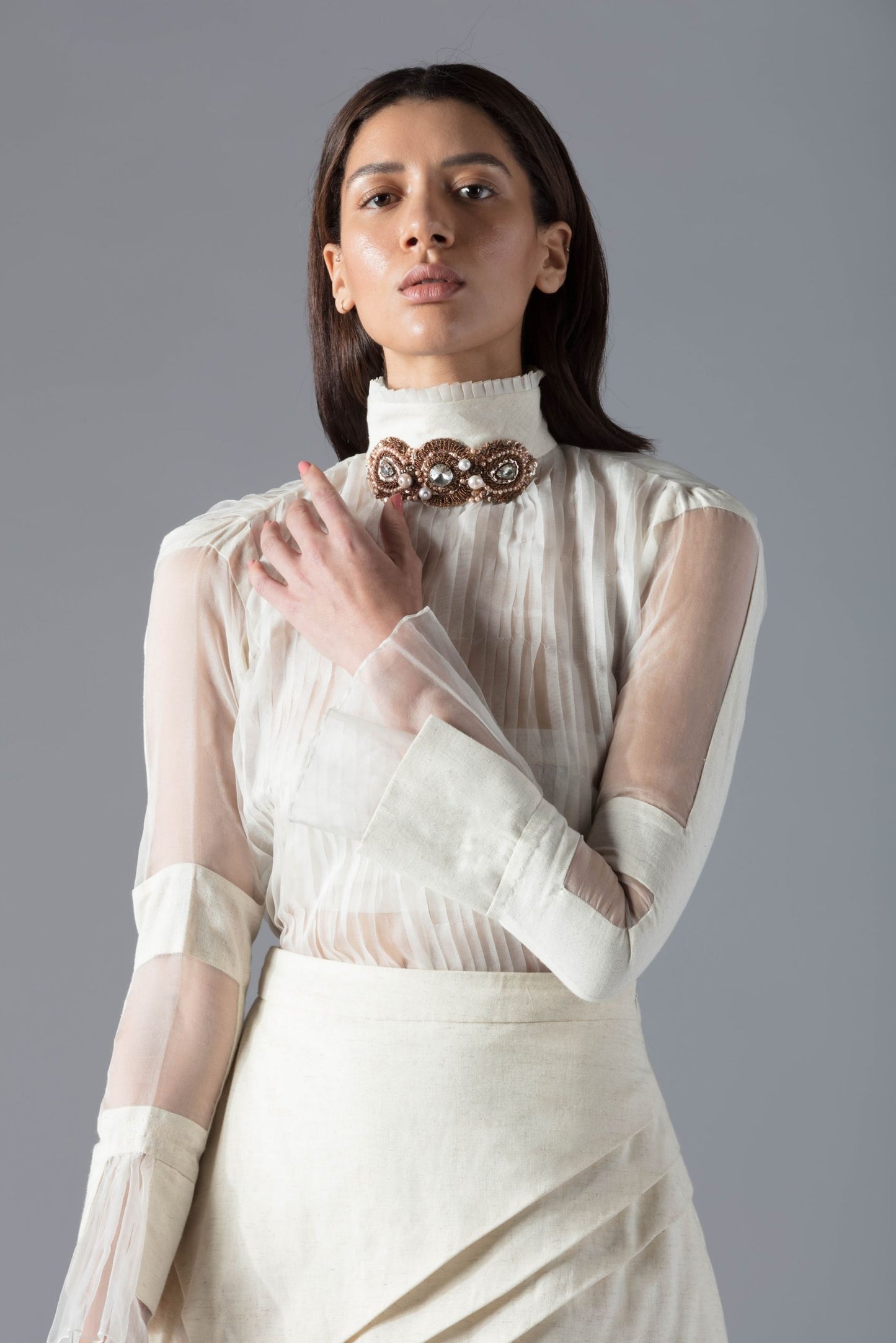 Designer wear top with elegant detailing and premium fabric, showcasing high-fashion craftsmanship