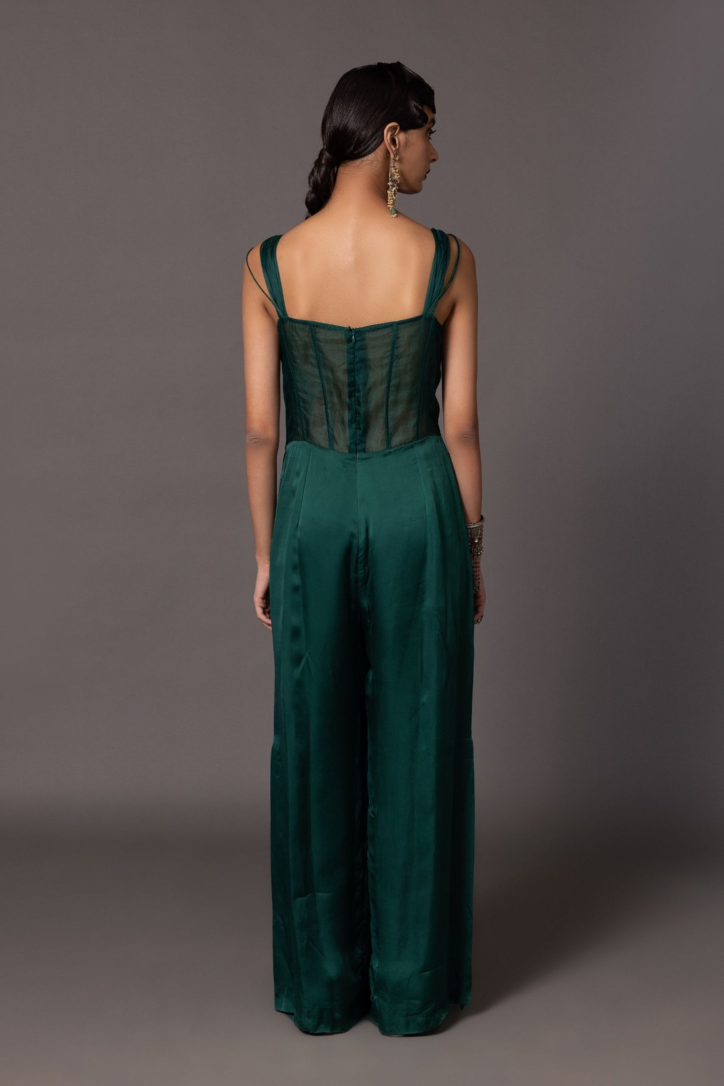 Back view of the Namib Bottle Green Women's Designer Jumpsuit, showcasing the overall structure and fit