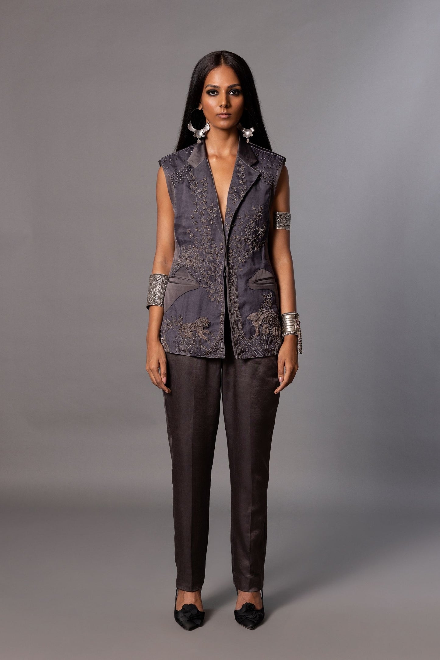 Shikhar Baugh Charcoal Embroidered Jacket with intricate motifs, paired with classic trousers, creating a stylish women's outfit