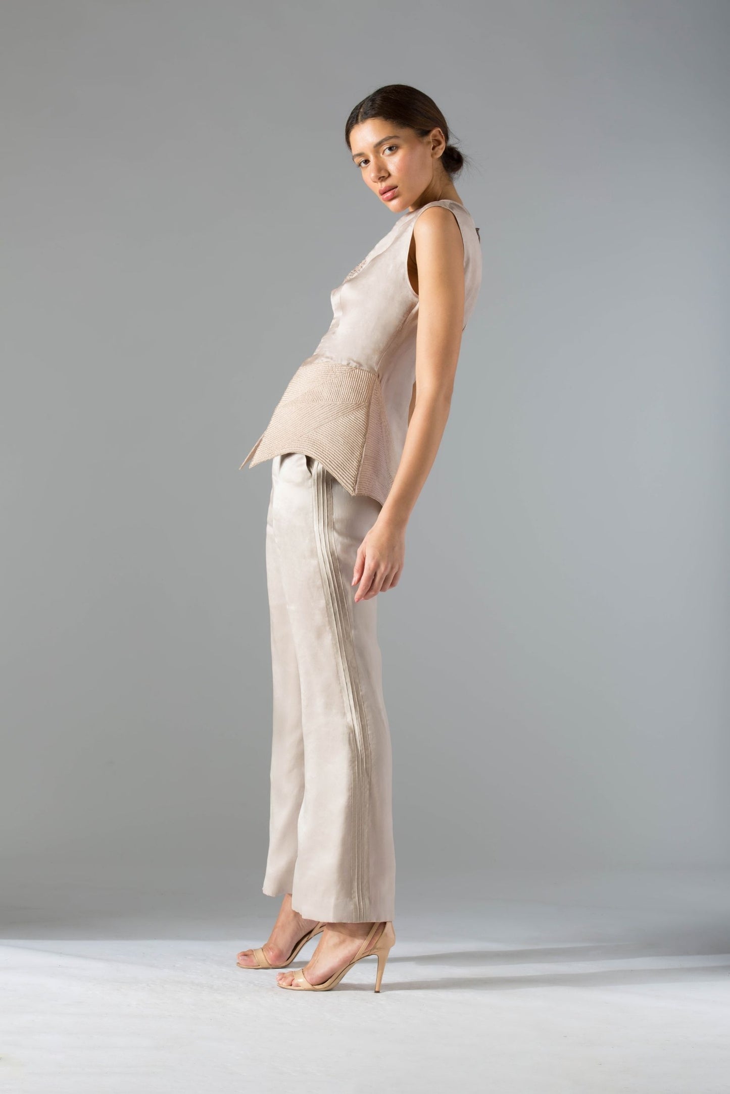 Side view of the designer co-ords set, emphasizing the silhouette and detailing of the high-waisted organza pants