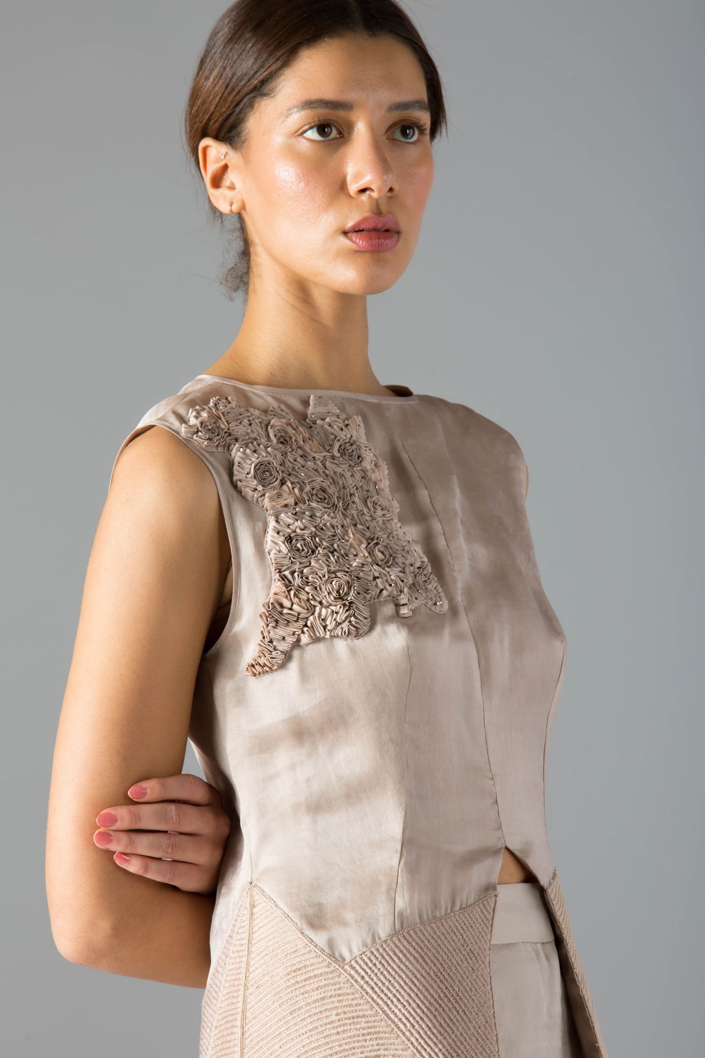 Close-up of the hand embroidery and fabric manipulation on the designer co-ords set, highlighting intricate details