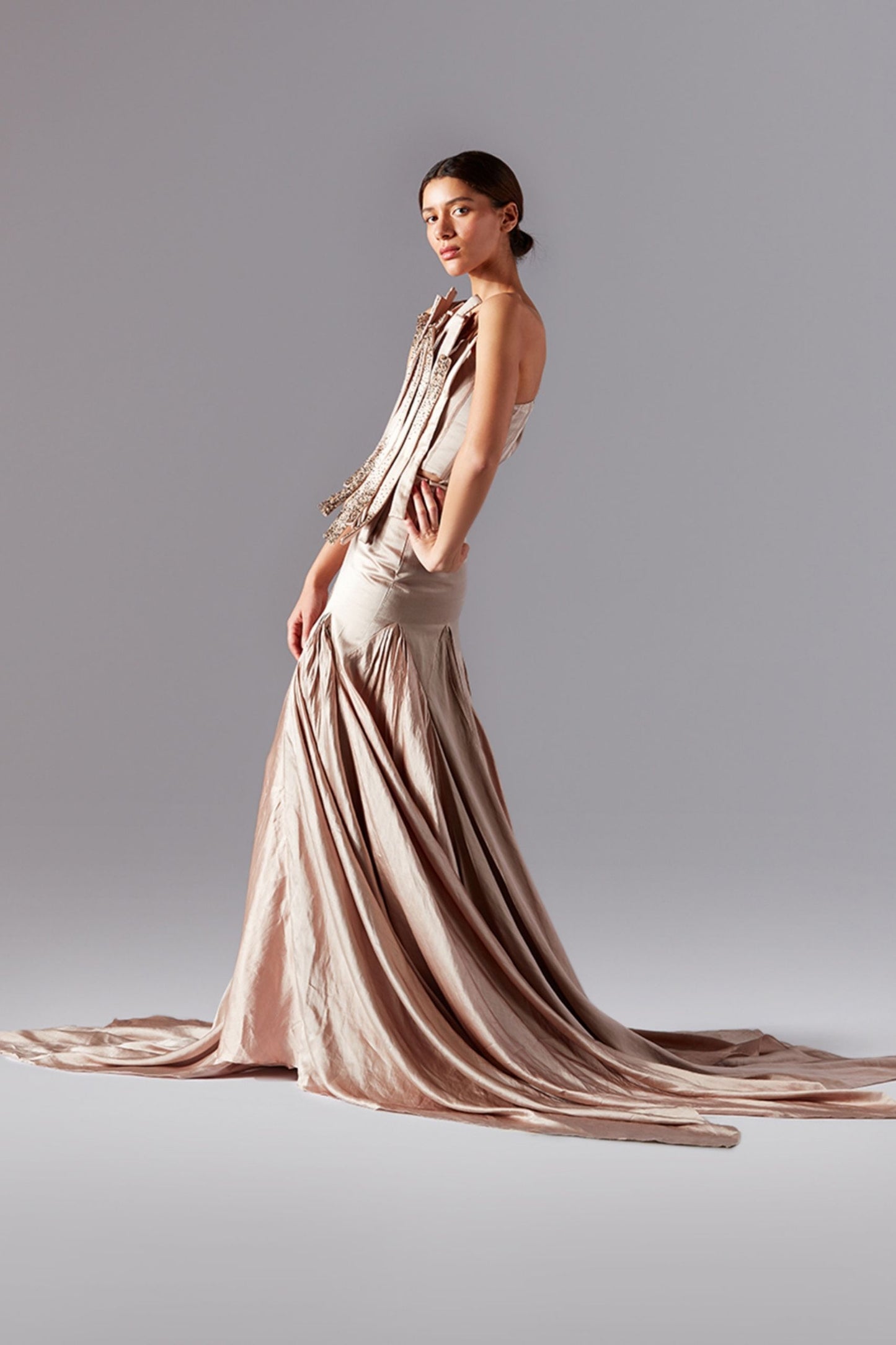 Side profile of a woman in the bouquet corset and trail skirt, highlighting the elegant fit and flow