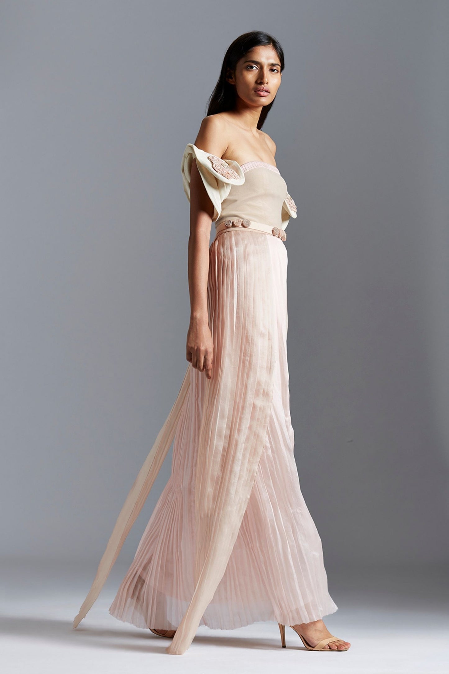 Side view of stylish luxury pleated tube dress with Peruette sleeves and satin organza fabric