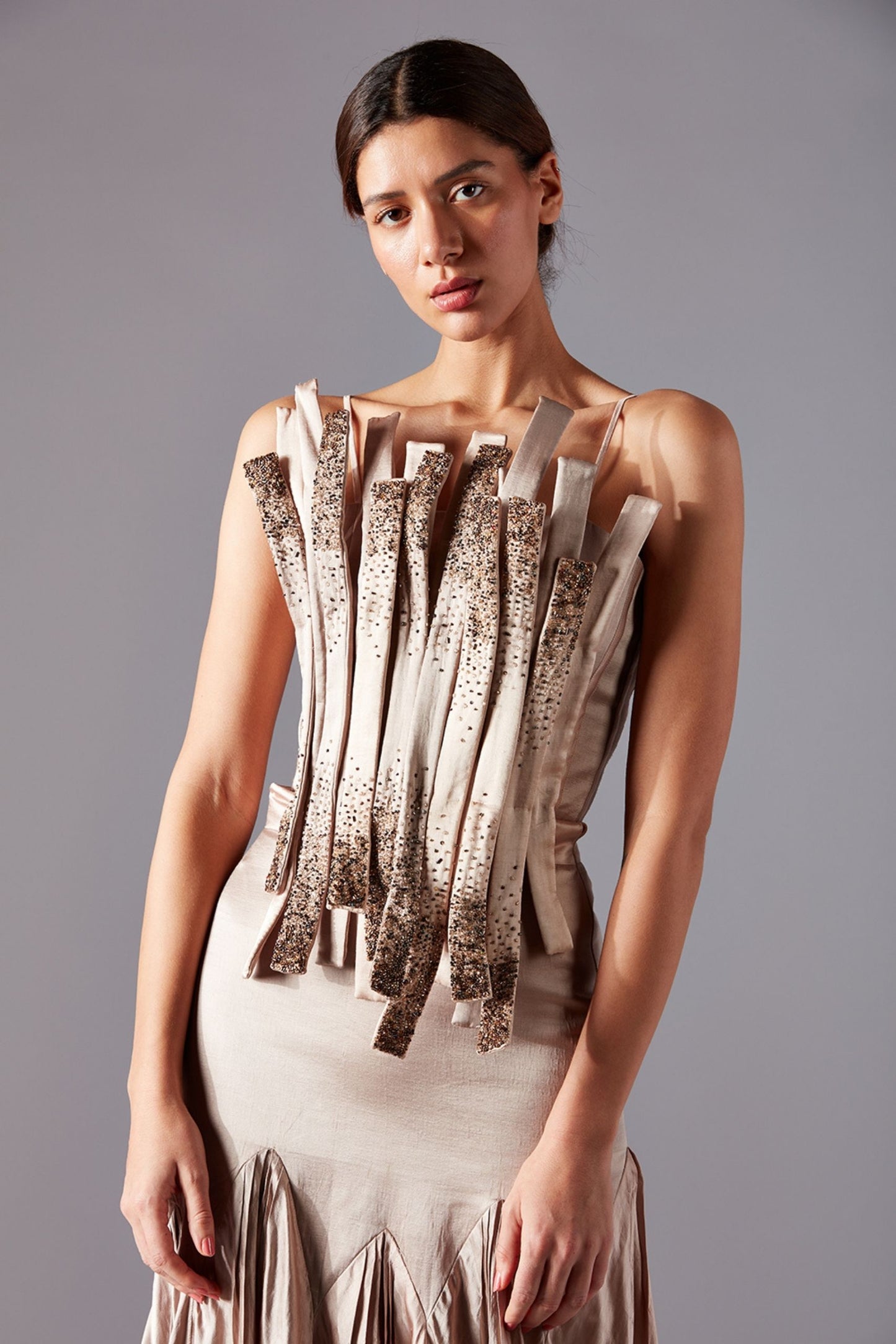 Close-up view of the intricate bouquet corset design and fabric details on the trail skirt