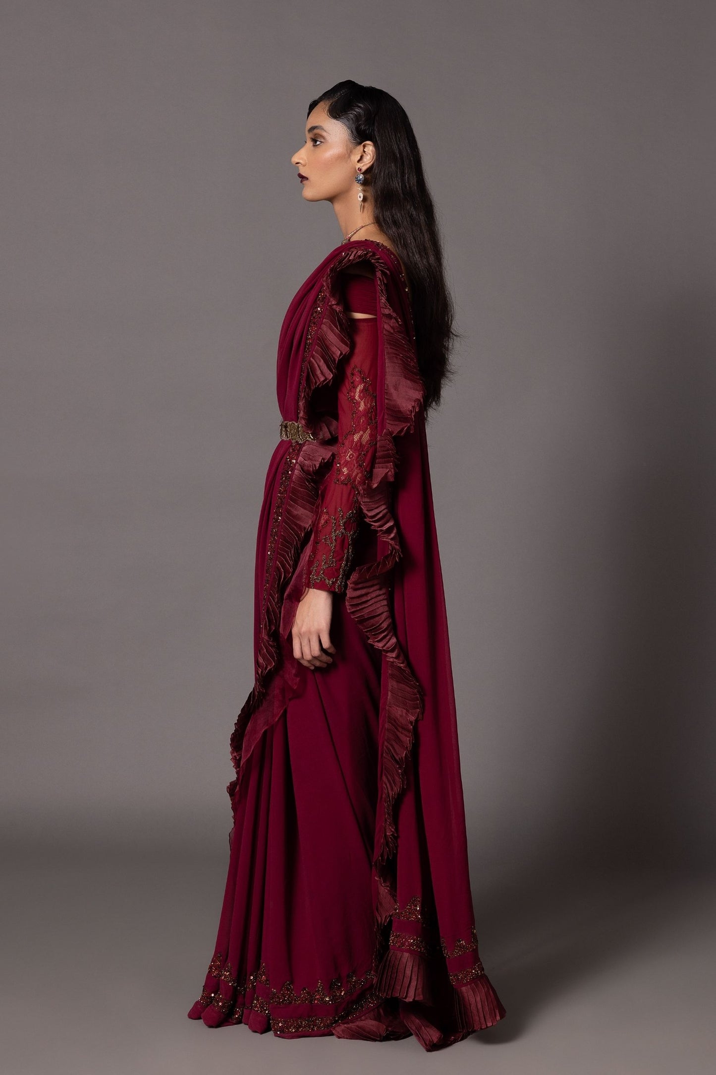 Elegant maroon off-shoulder sequin blouse with detailed embroidery and beadwork, a stunning blouse style for sarees