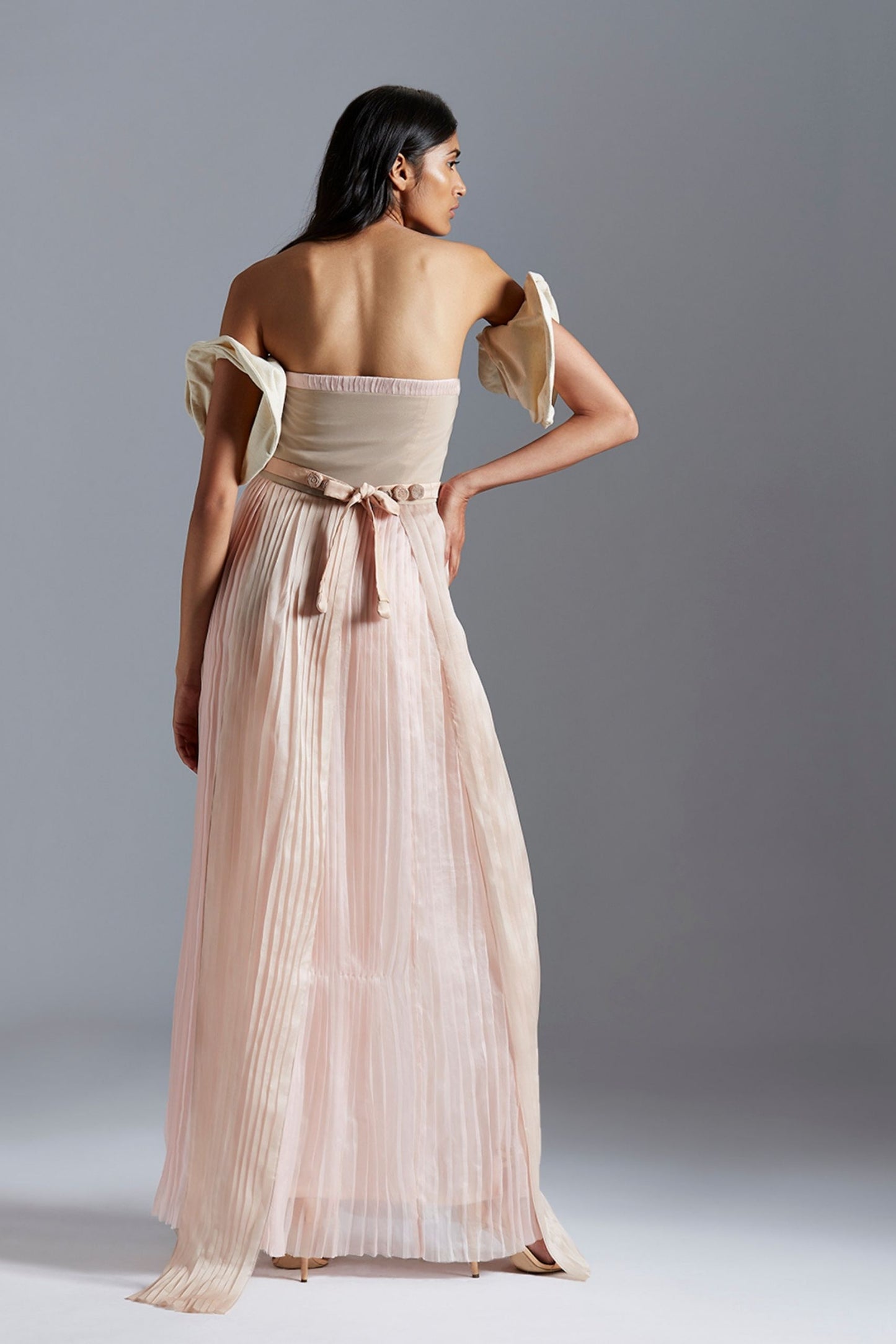 Back view of the luxury pleated tube dress showcasing the modern design and elegant satin organza material