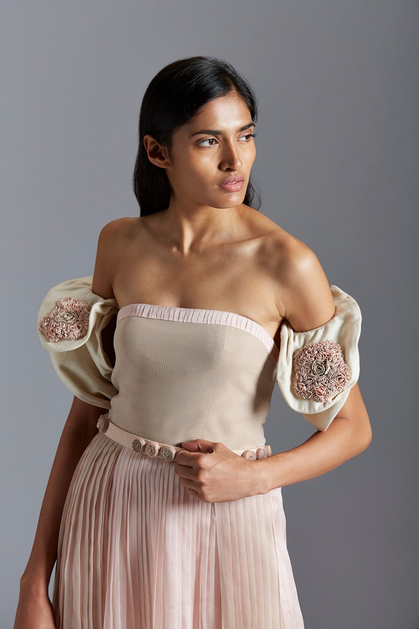 Close-up of the handmade pleats and Peruette sleeve details of the luxury tube dress for women