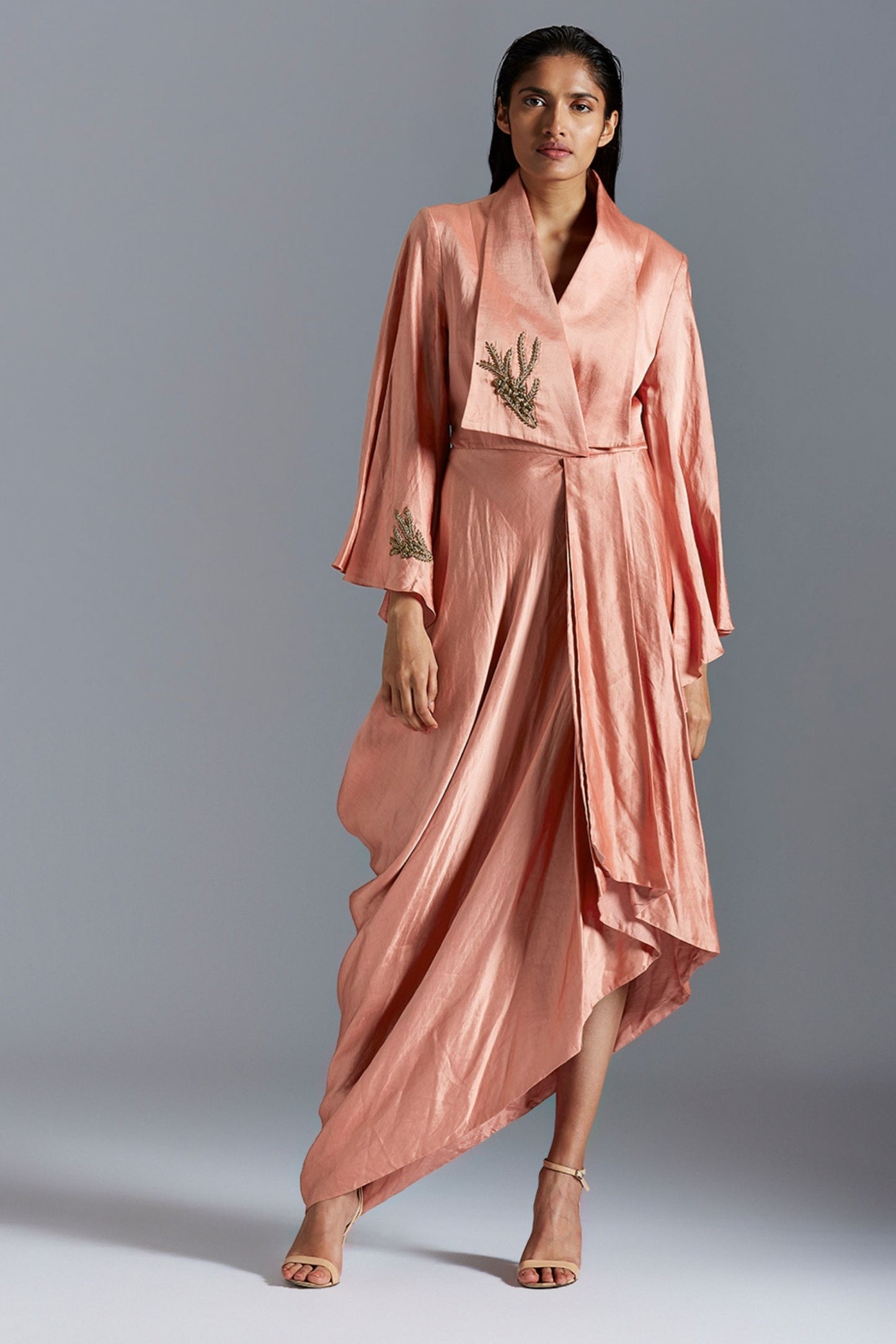 Iconic draped dress for women with golden metallic detailing, offering an elegant and modern silhouette