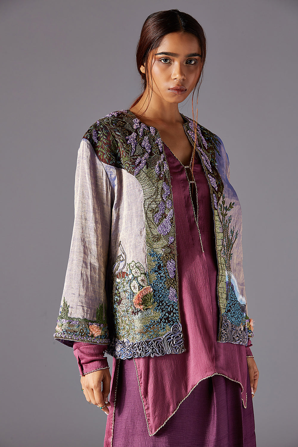 Full-length front view of the Jacobean handwork and metallic details on the embroidered jacket, highlighting the craftsmanship.