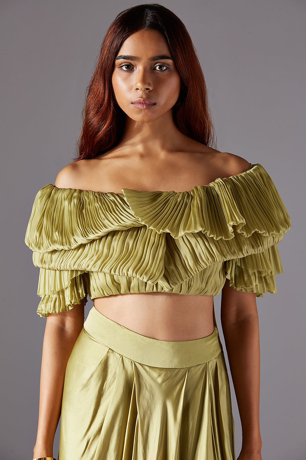 Modern blouse, highlighting the flowing fabric and design.
