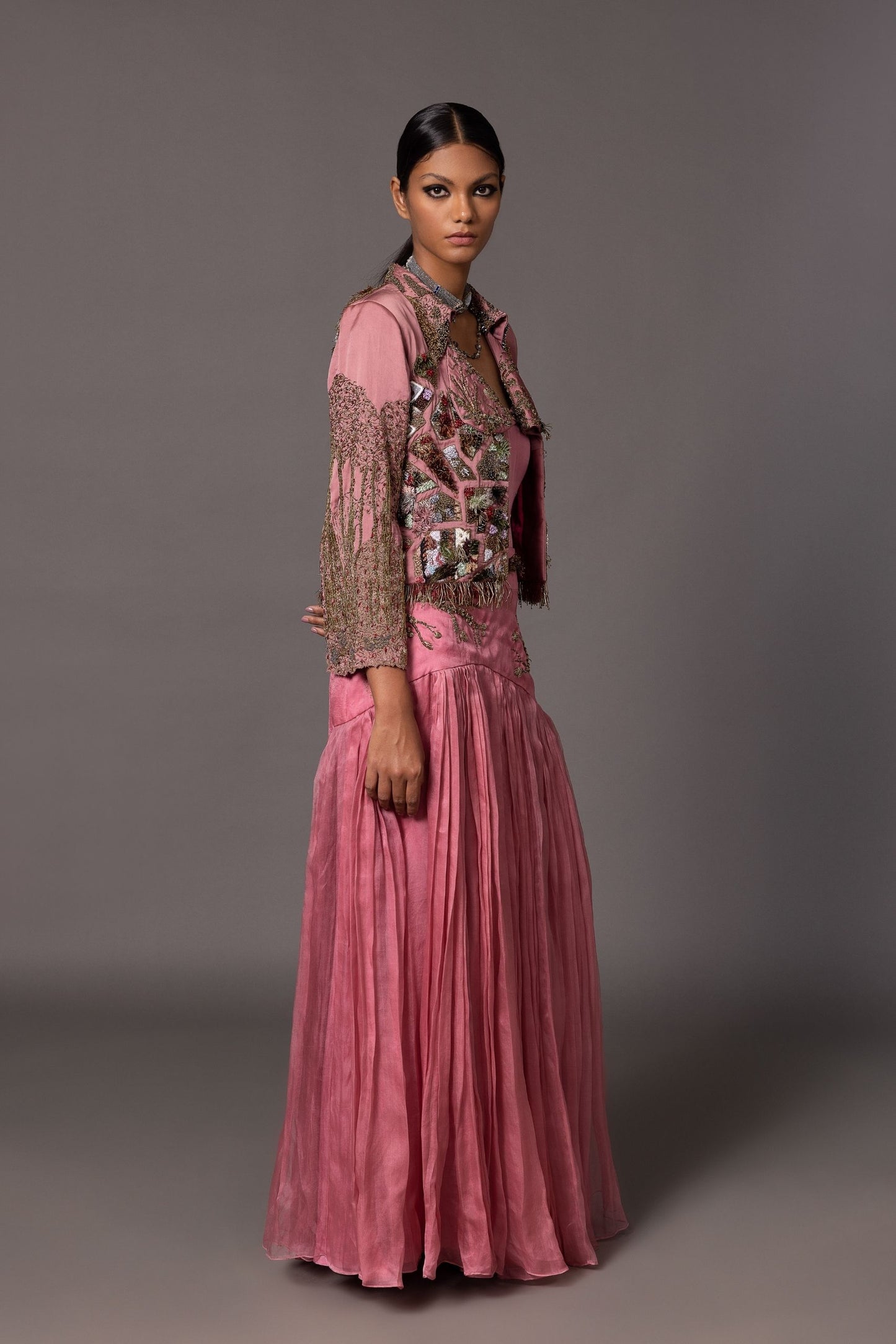 Side view of the Kaner Pink Corset Top & Skirt with Earth Jacket, highlighting the fit and embroidery on the jacket