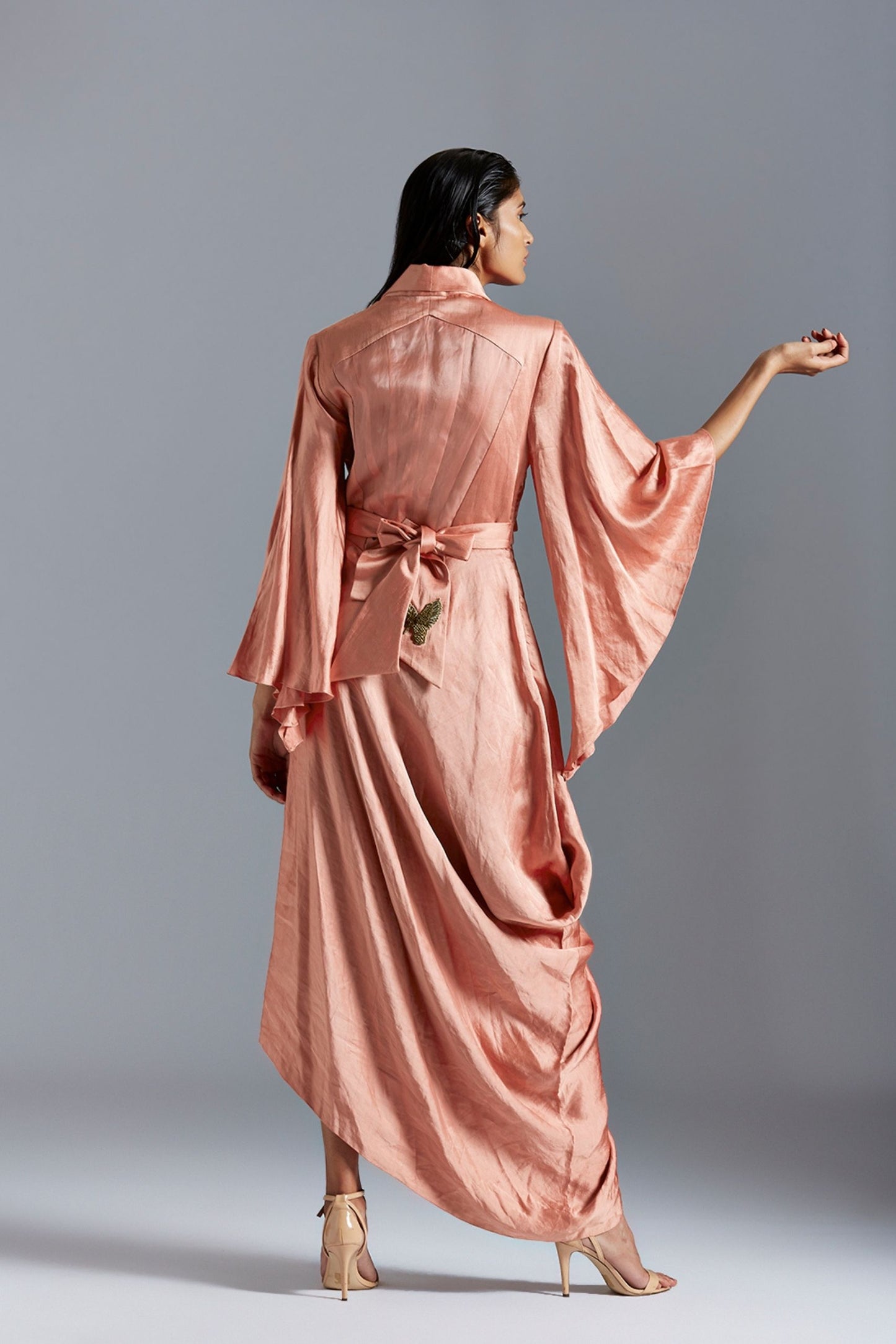 Back view of the draped dress for women, showcasing the elegant silhouette and unique design