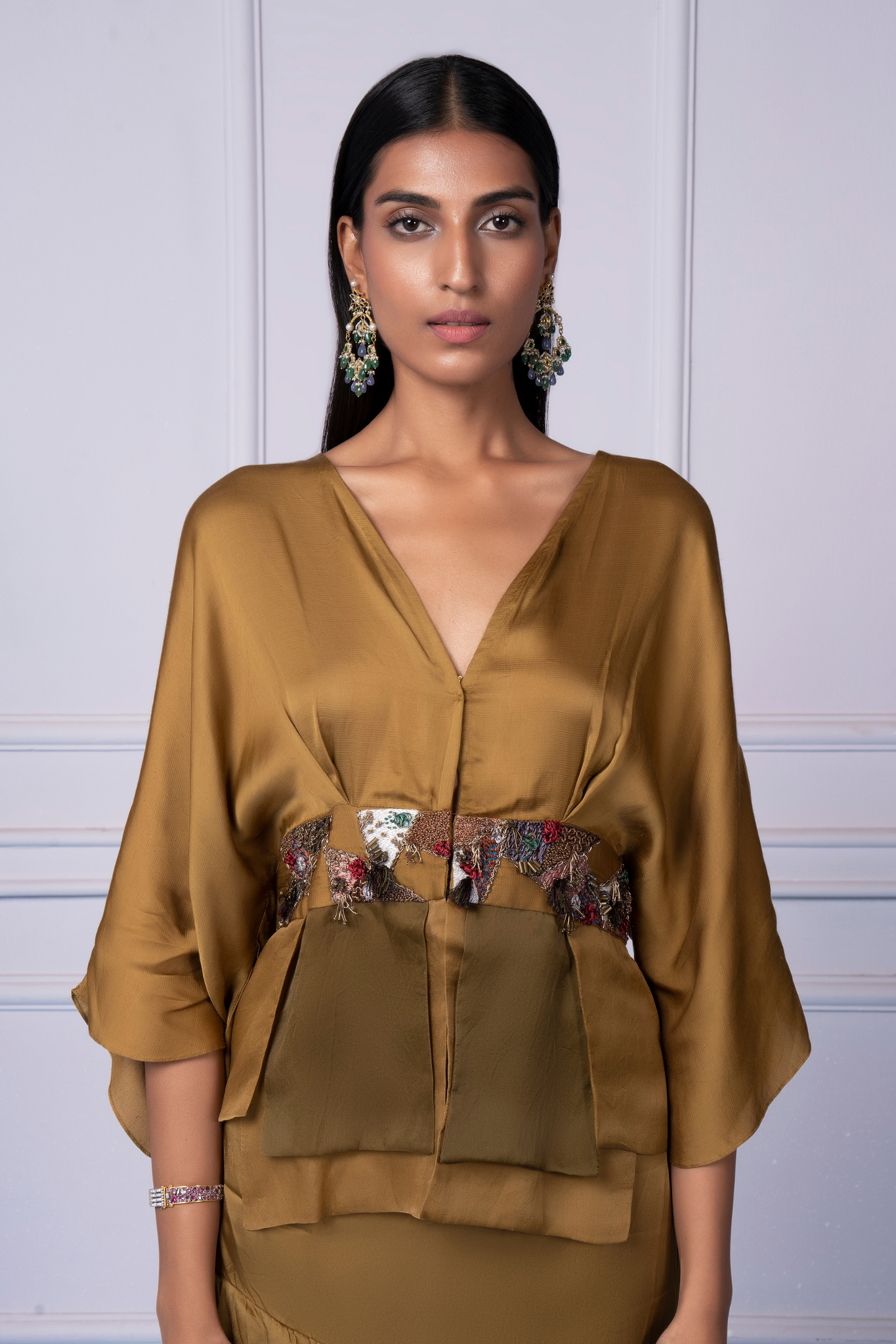 Close-up of the gold embroidery on the Bhutani top, showcasing the intricate design and elegant detailing