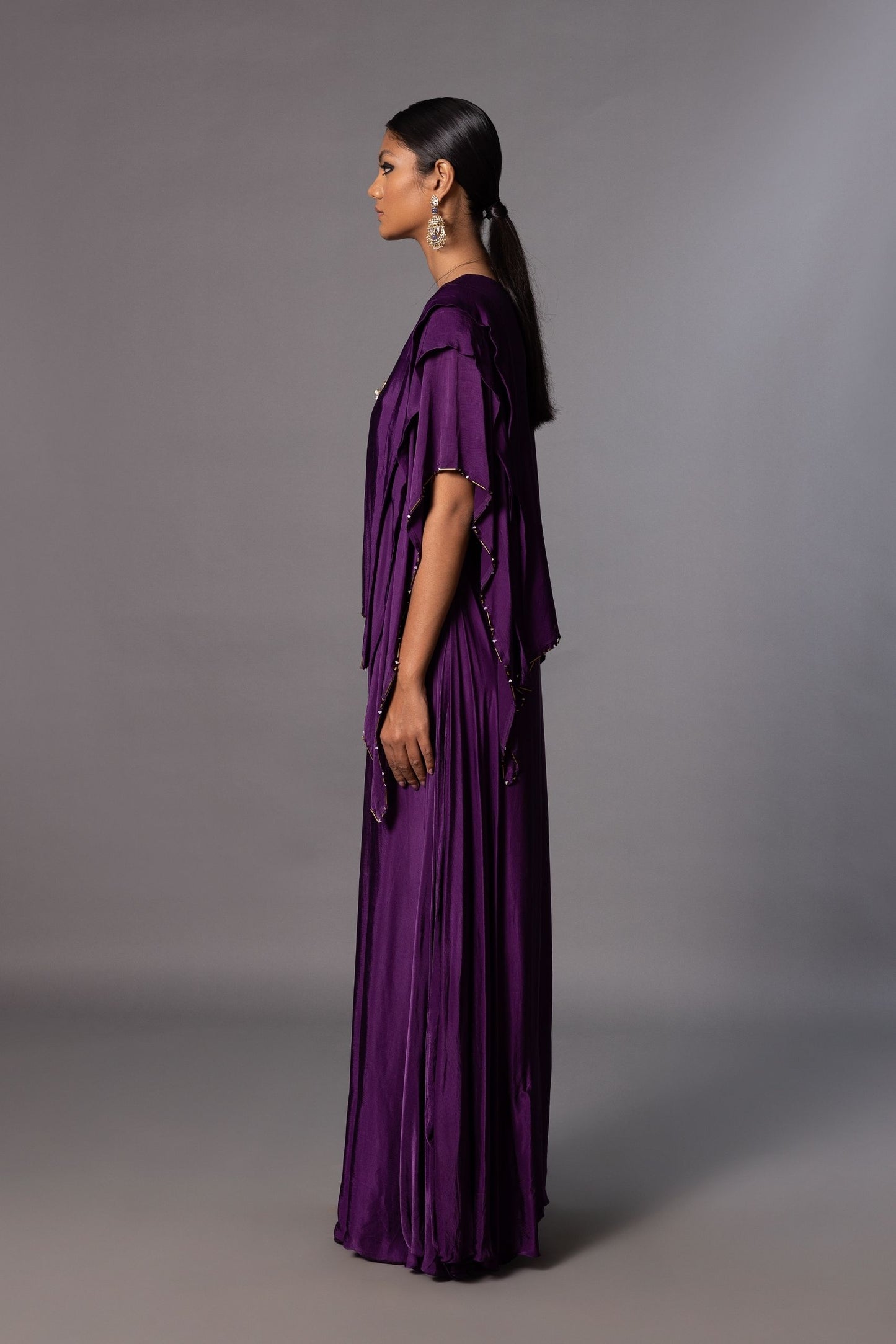 Side view of the Iris Embroidered Kaftan Gown, showcasing the flowing silhouette and draped sleeves