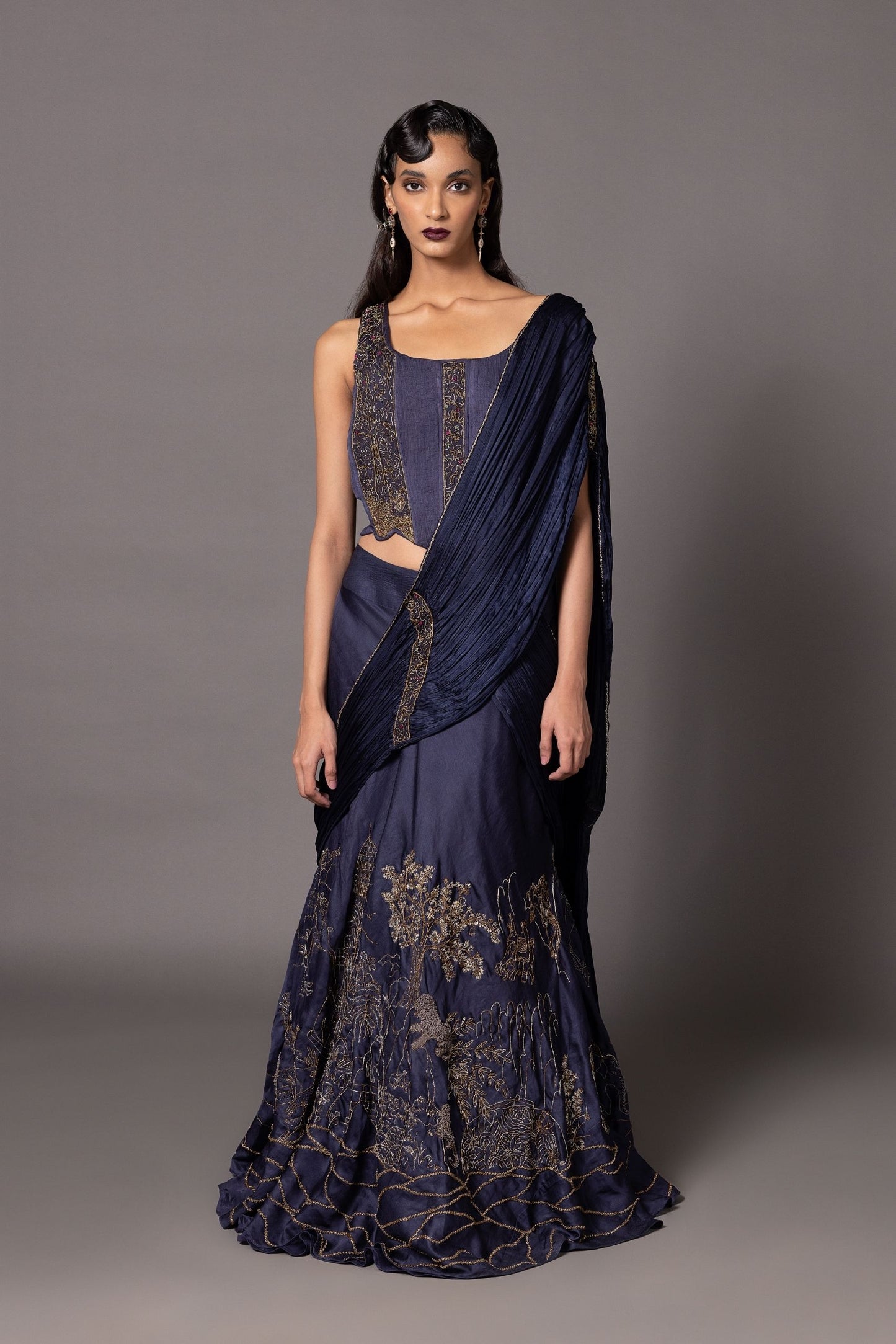 Navy blue Shikharbaugh lehenga set with 3D animal motifs, tailored corset, and ruched dupatta with metallic embroidery from A Humming Way