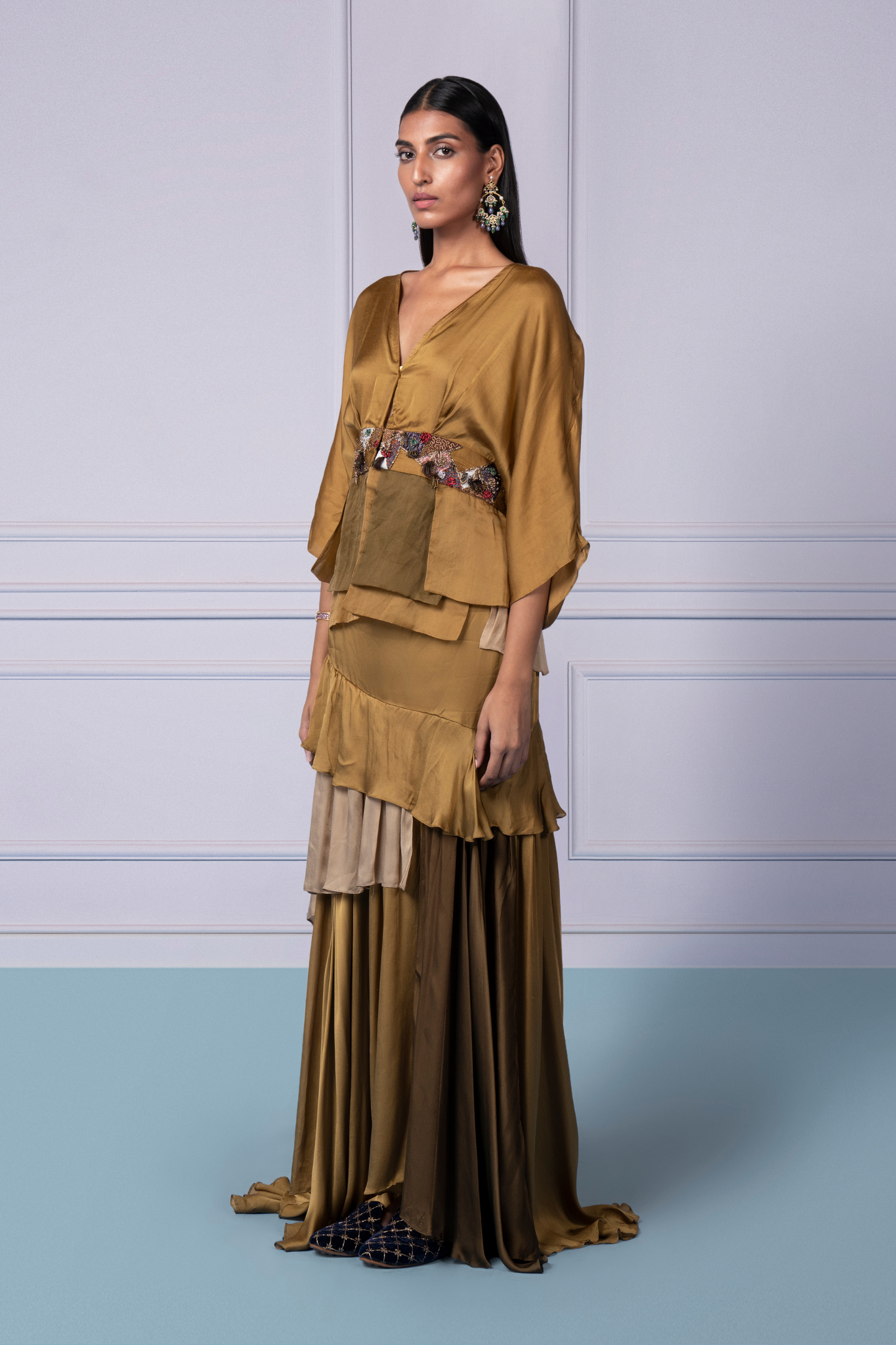 Side view of the Bhutani top with gold embroidery and frill skirt, highlighting the flattering fit and stylish design