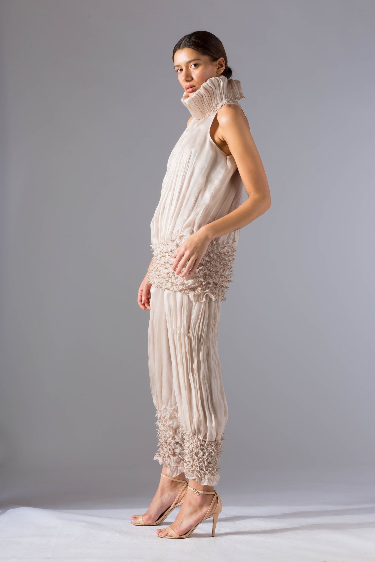 Side view of the top pant set for women, emphasizing the slim silhouette and sculpted pants