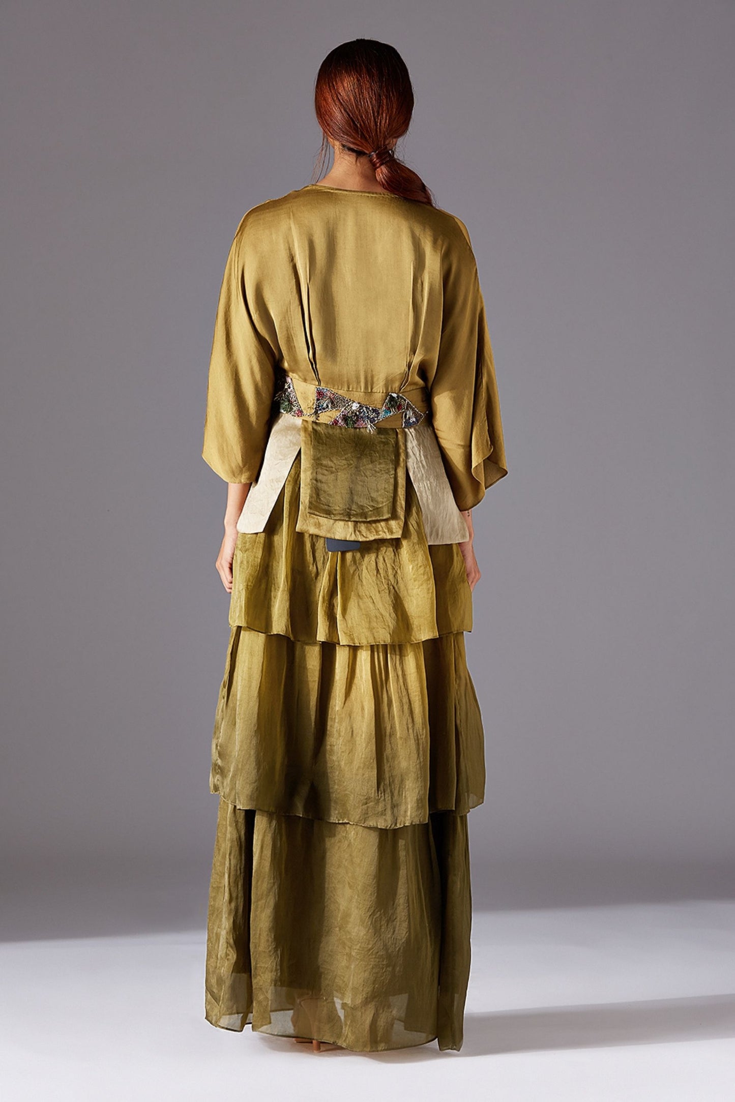 Back View of Topiary Bhutani Peplum Top and 3-Tiered Dress with Concealed Zip and Luxury Detailing