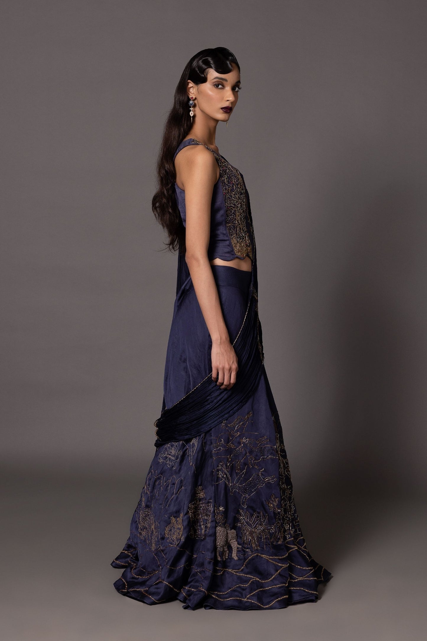 Side view of the Shikharbaugh Navy Blue Lehenga with metallic embroidery and ruched dupatta
