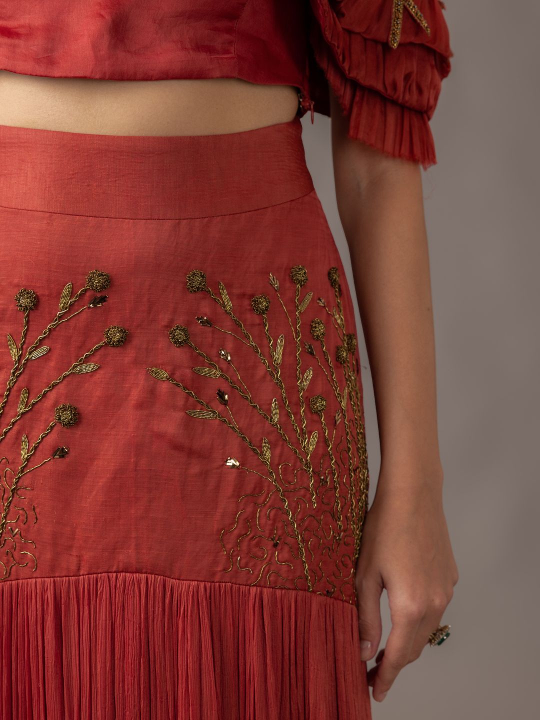 Chic Gill Fungi Blouse and pleated Thar Skirt, perfect for fashion-forward women’s party attire.