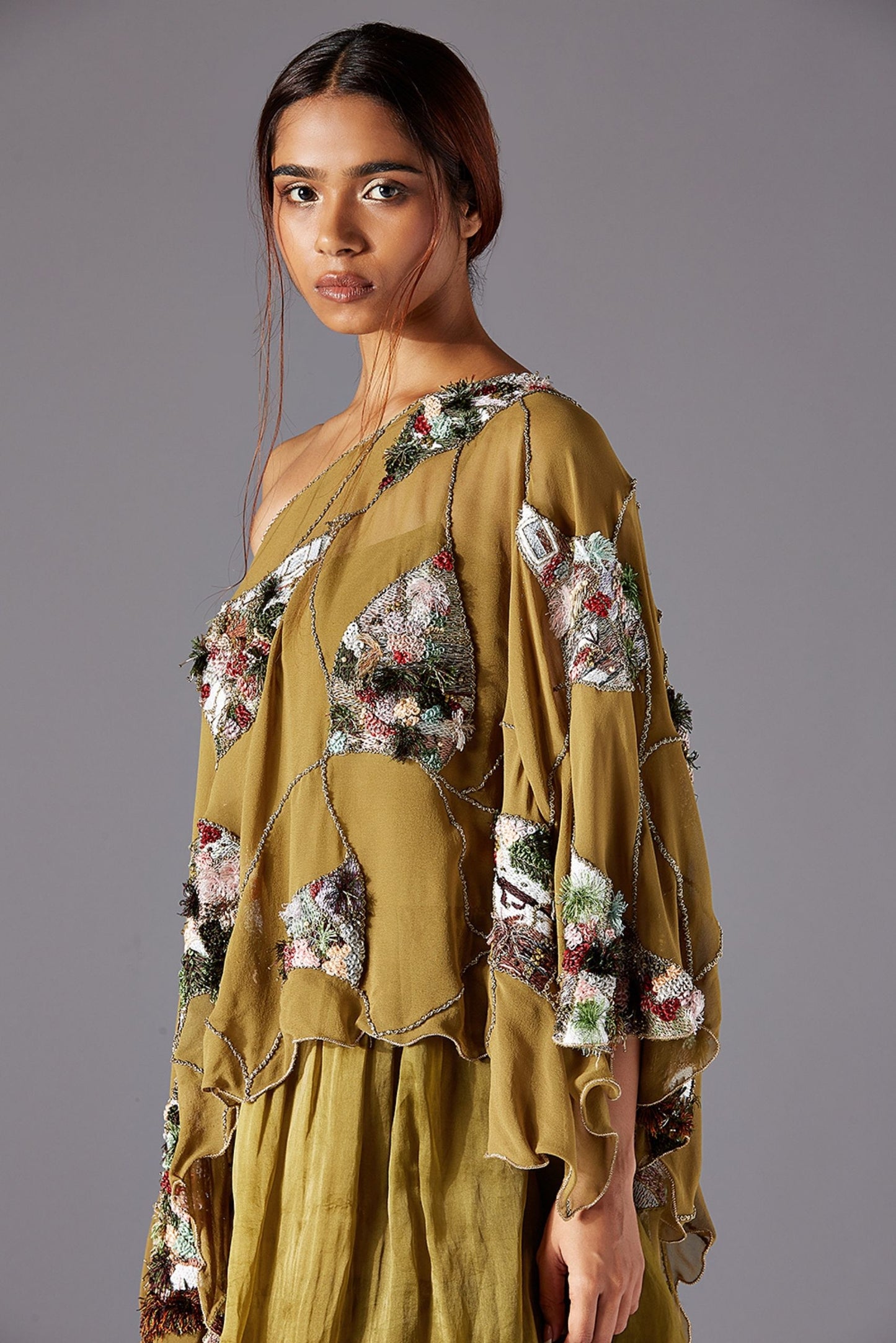 Detailed Focus on Dip Dye and Jacobean Handwork on One Shoulder Cape & 3-Tiered Ankle Length Dress