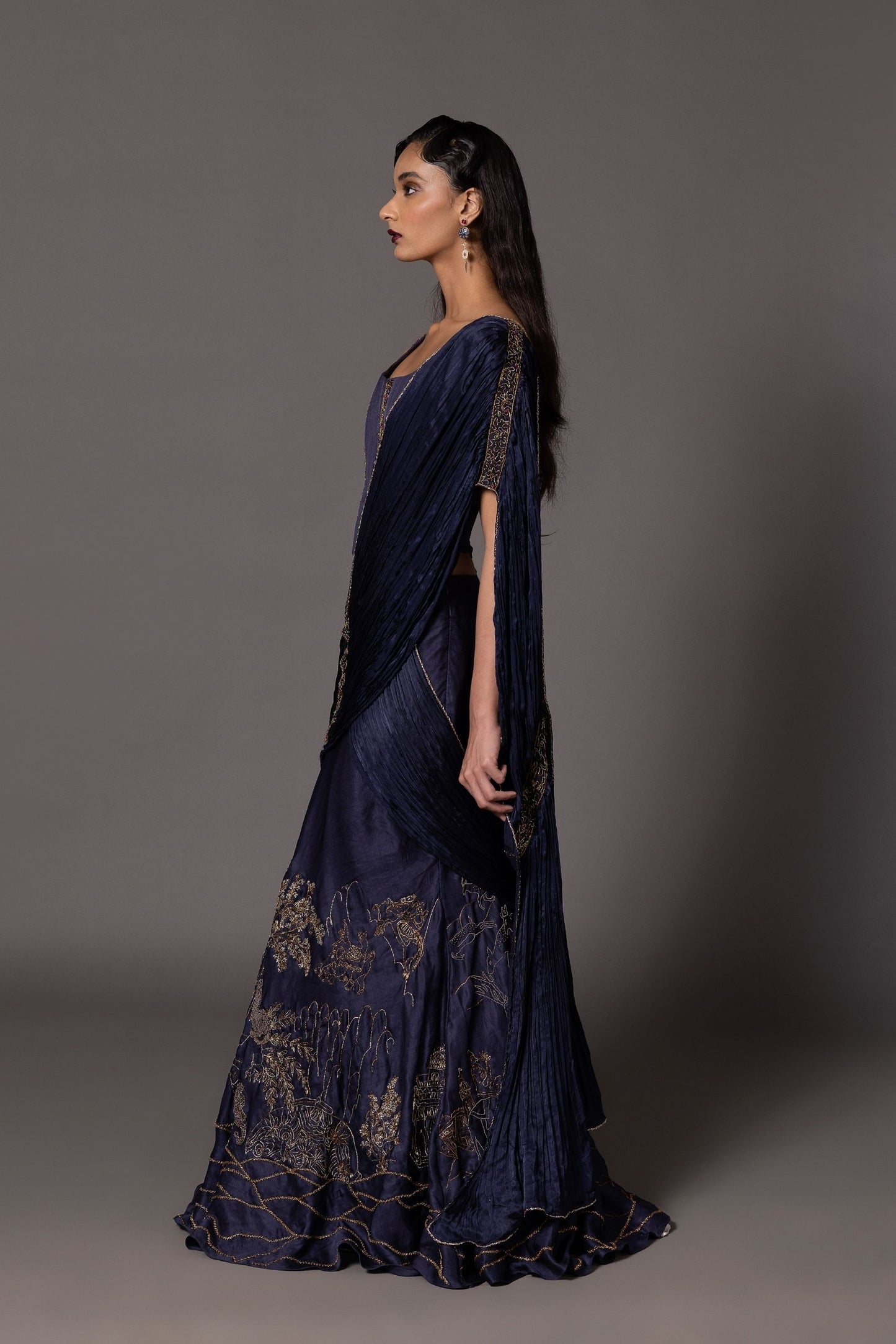 Side view of the Shikharbaugh Navy Blue Lehenga Set highlighting the tailored corset and ruched dupatta with metallic embroidery