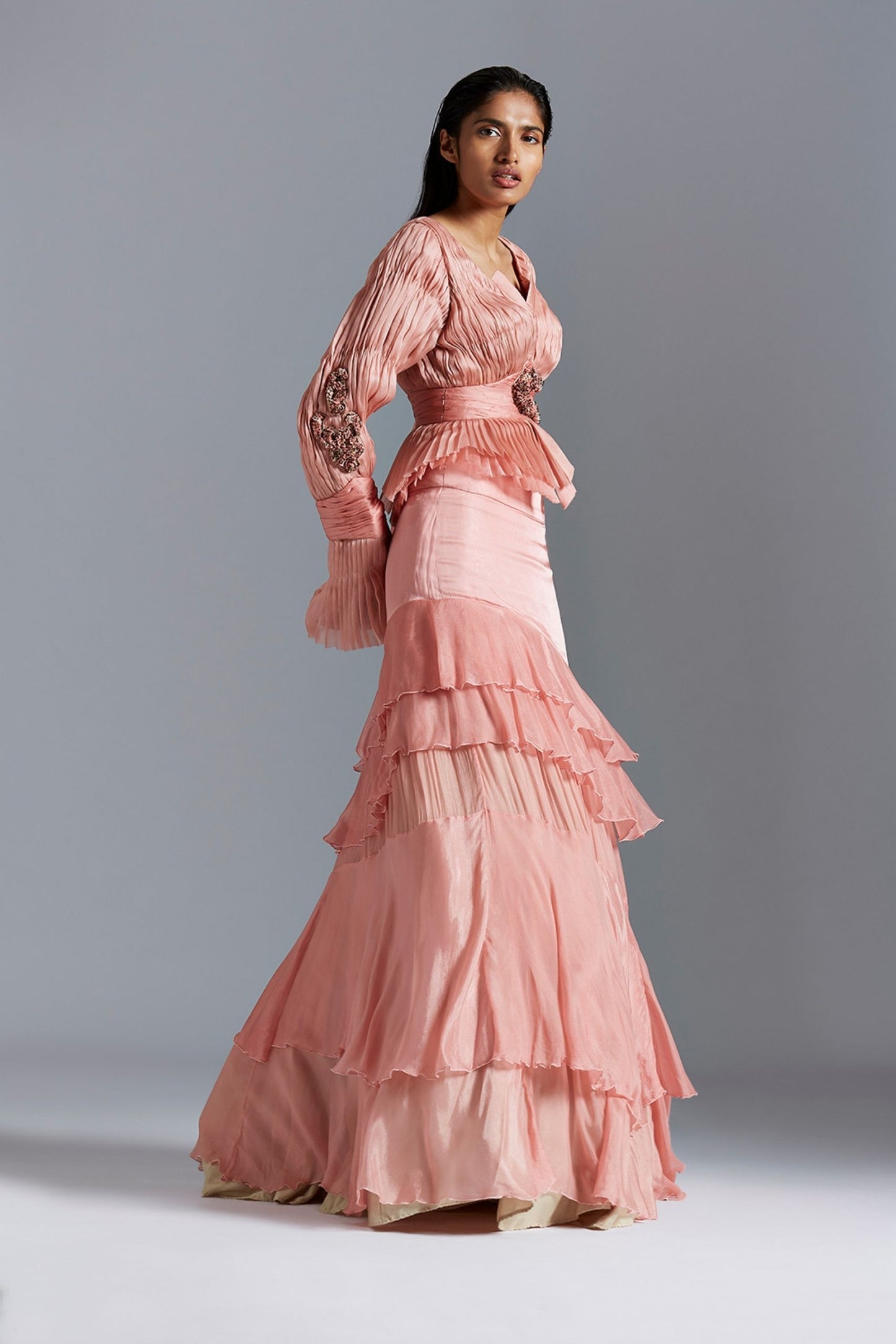 Side view of the peplum top with Victorian sleeves and the flared satin skirt, showcasing the silhouette