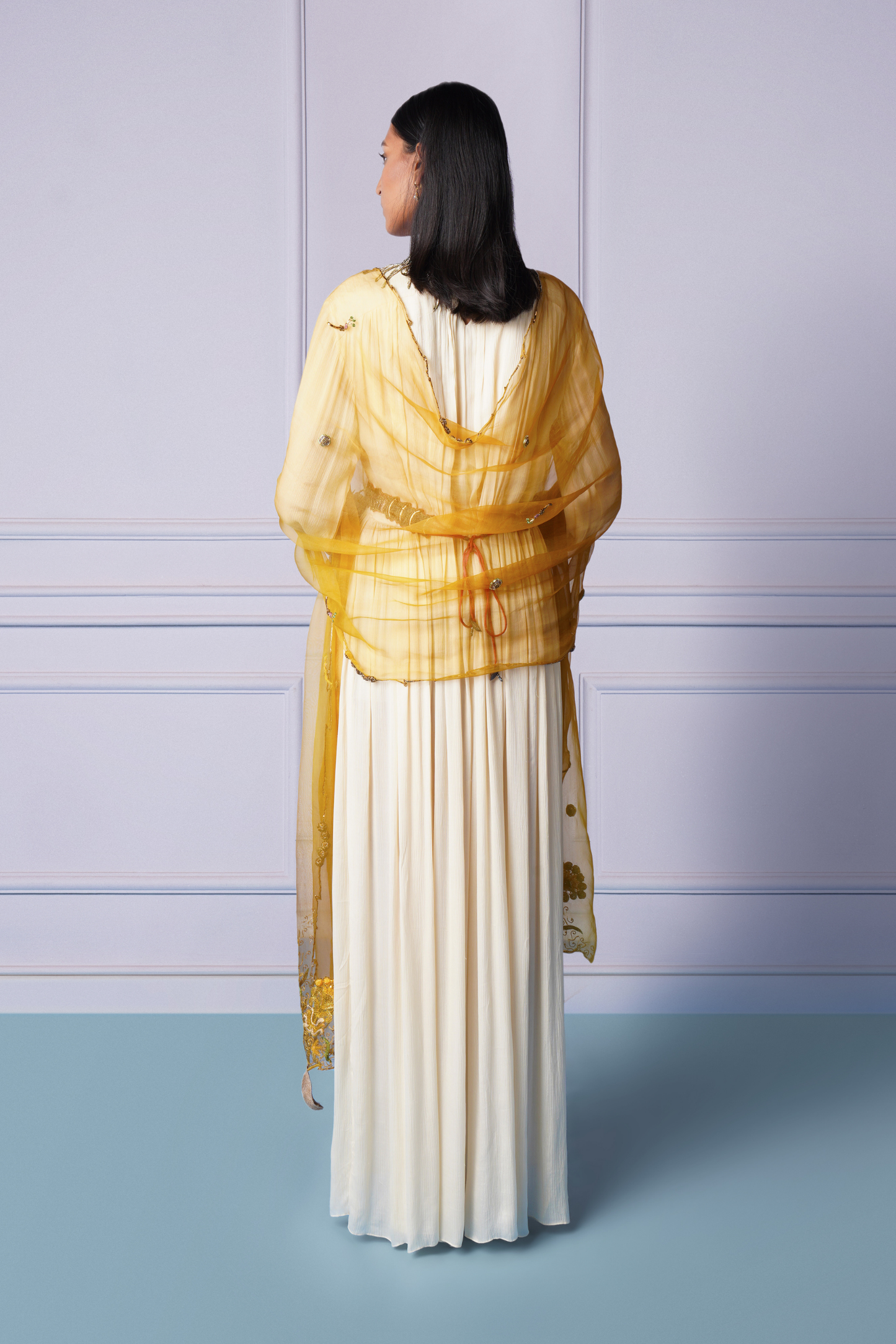 Back view of ivory gown with embroidered dupatta and belt for an elegant look