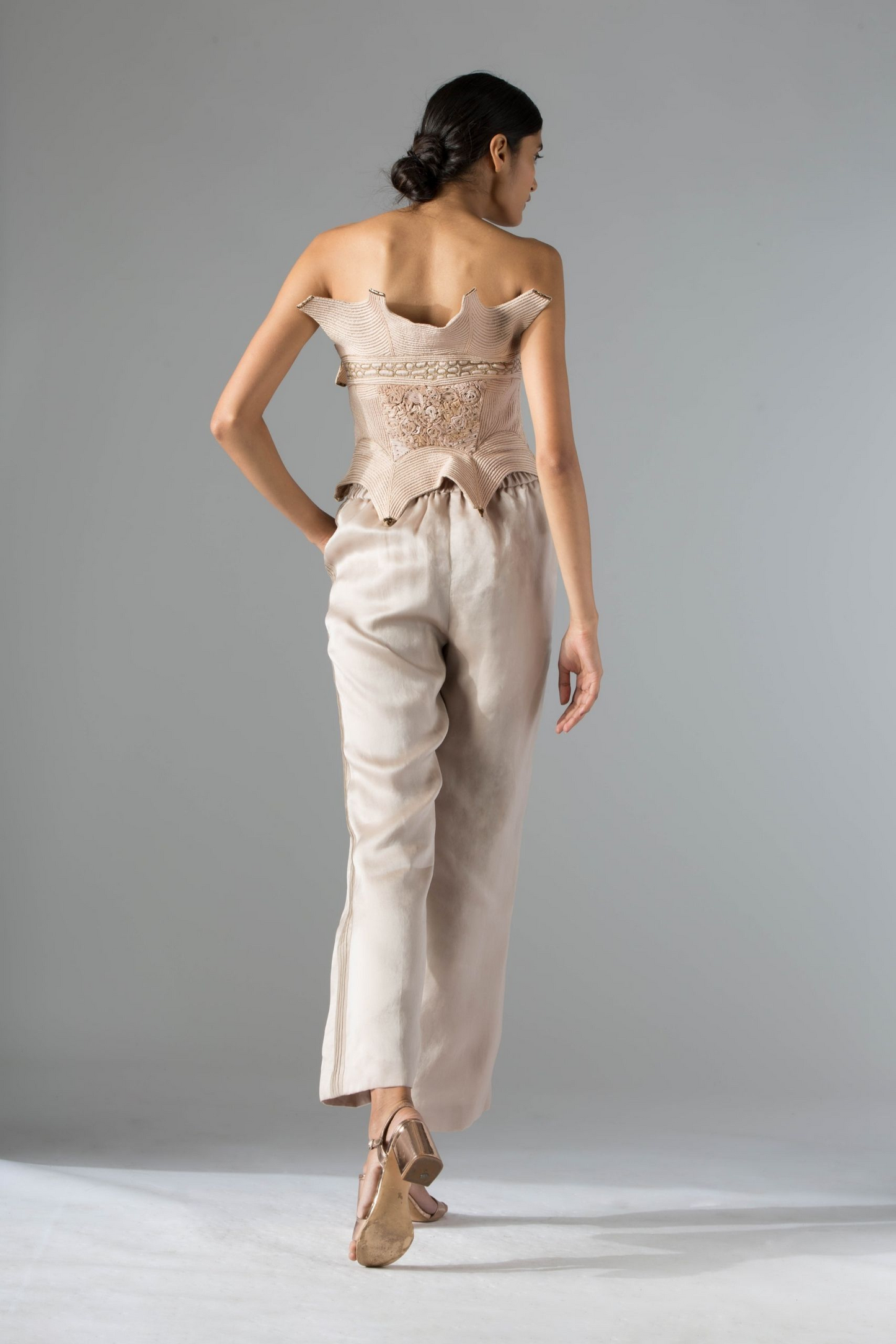 Back view of the Dune corset top, showcasing its sleek and fitted design with fine detailing