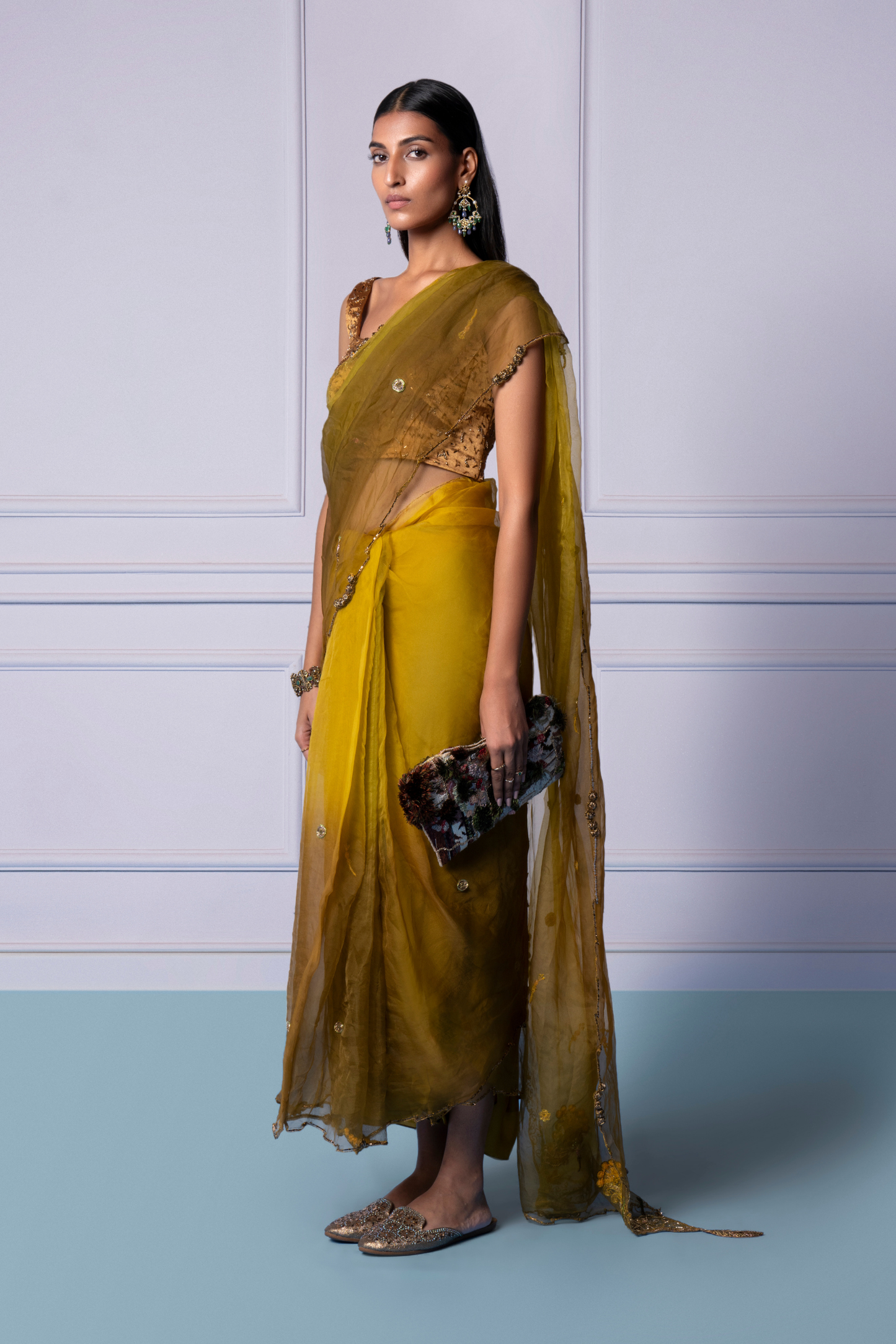 Side view of embellished Dandelion Yellow saree paired with stylish blouse