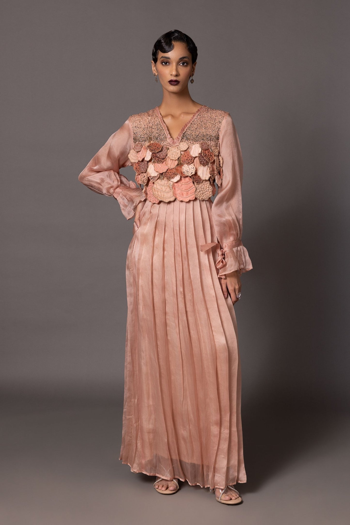 Mima Mounds Pink Gown featuring 3D hand-embroidered leaves and hand-set pleating, a perfect luxury designer gown for women's special occasions