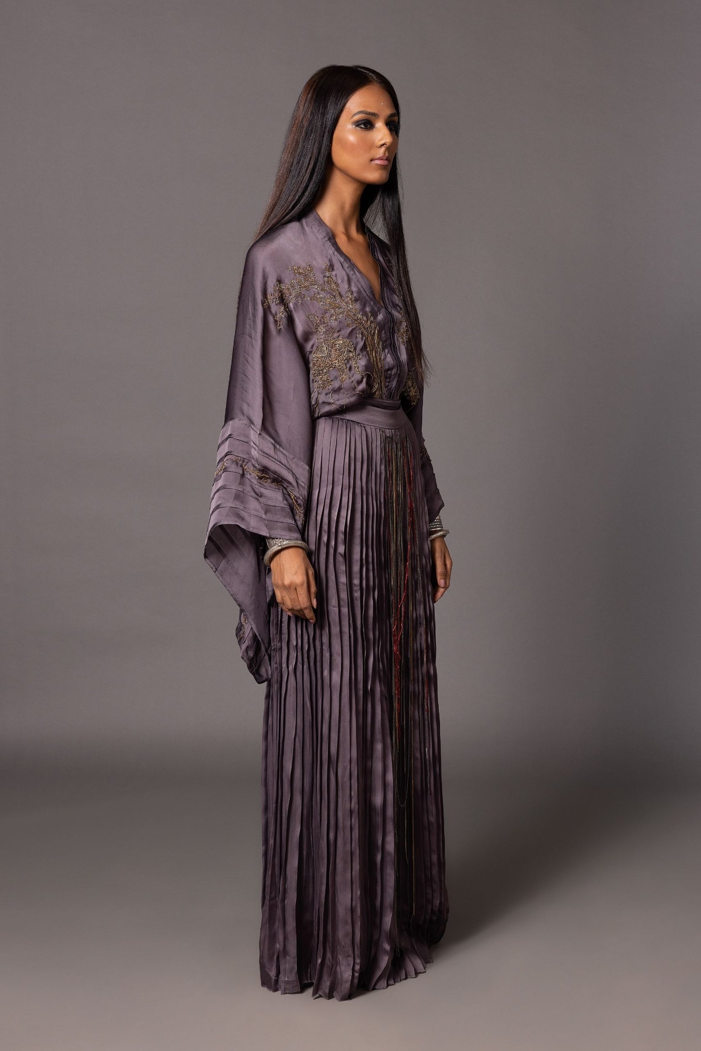 Side view of the Shikhar Baugh Charcoal Kimono Top and hand-pleated skirt set, showcasing the silhouette and the flow of the skirt