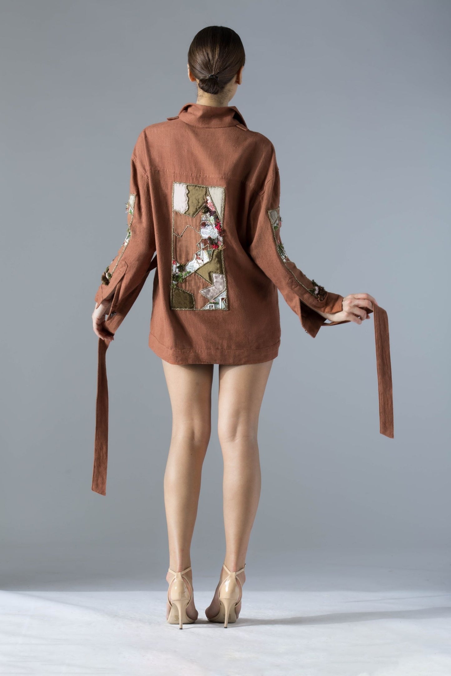 Back view of the Maze Khadi shacket for women, showcasing the clean lines, tieable belt, and intricate handwork details