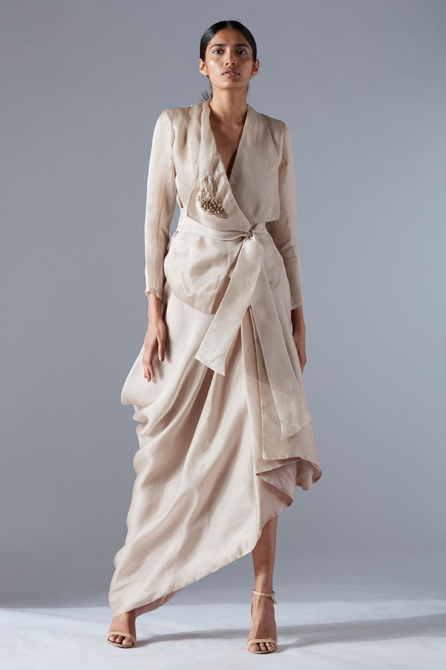 Stylish designer jacket with metallic embroidery paired with an iconic drape skirt, offering a chic and elegant fashion set for women