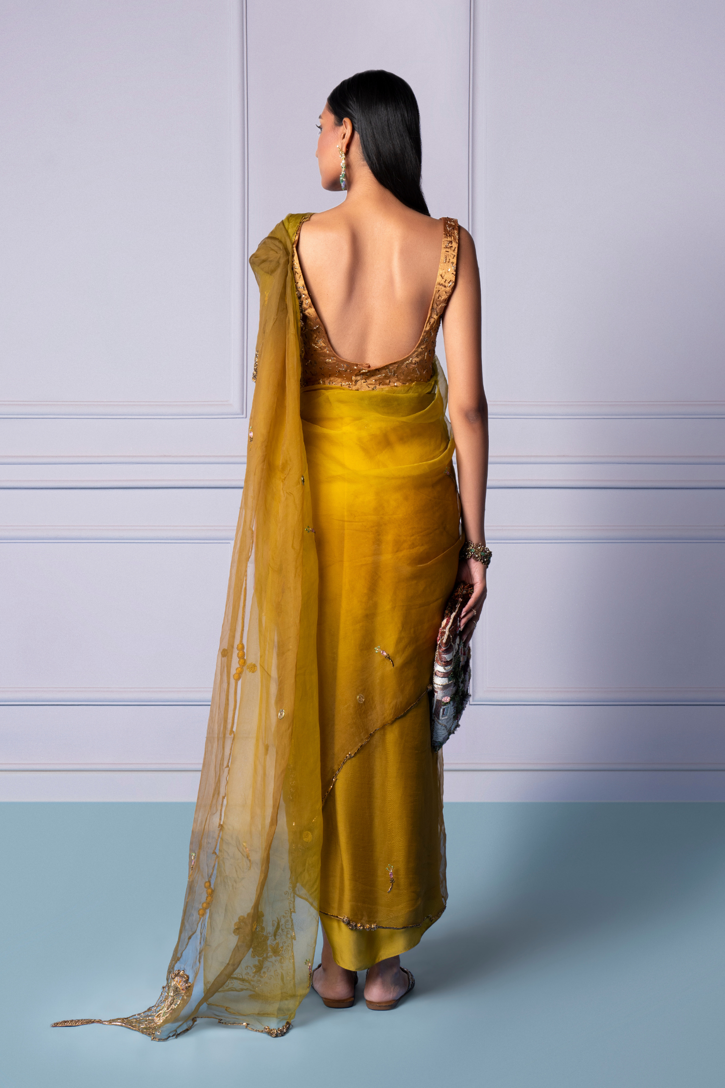 Back view of Dandelion Yellow saree with blouse and floral embellishments