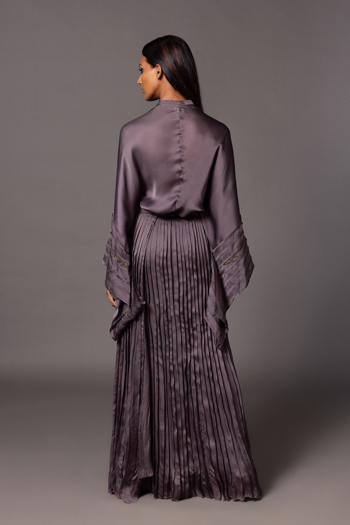 Back view of the Shikhar Baugh Charcoal Kimono Top with pleated skirt, emphasizing the design and fit