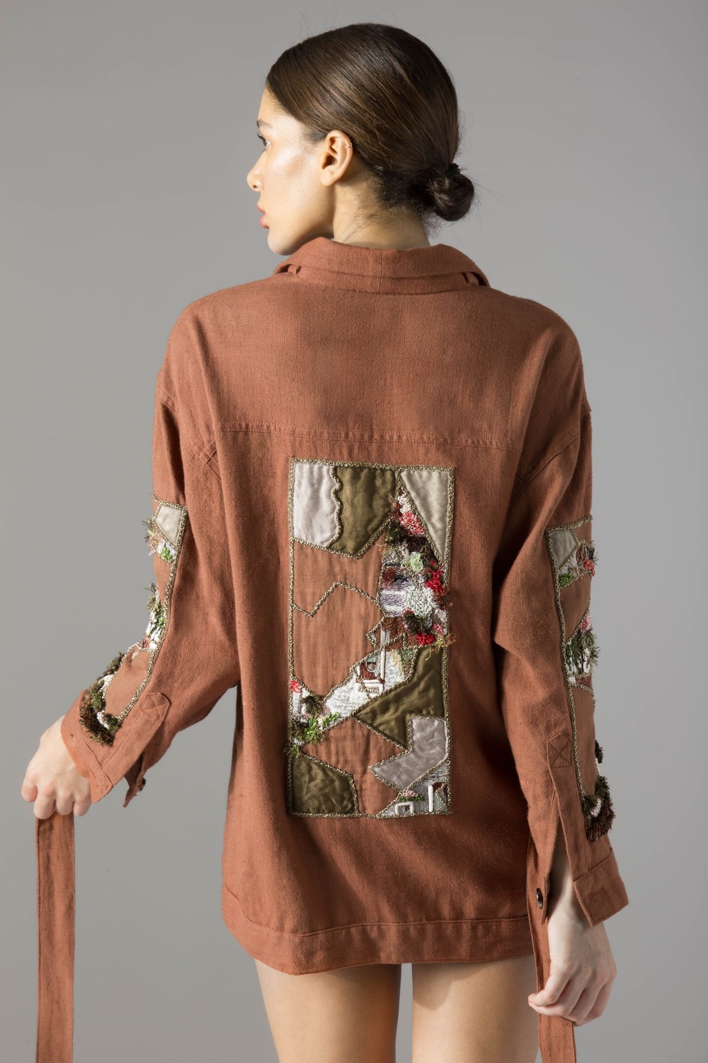 Back view of the shacket for women, emphasizing the tieable belt and clean lines of the khadi fabric